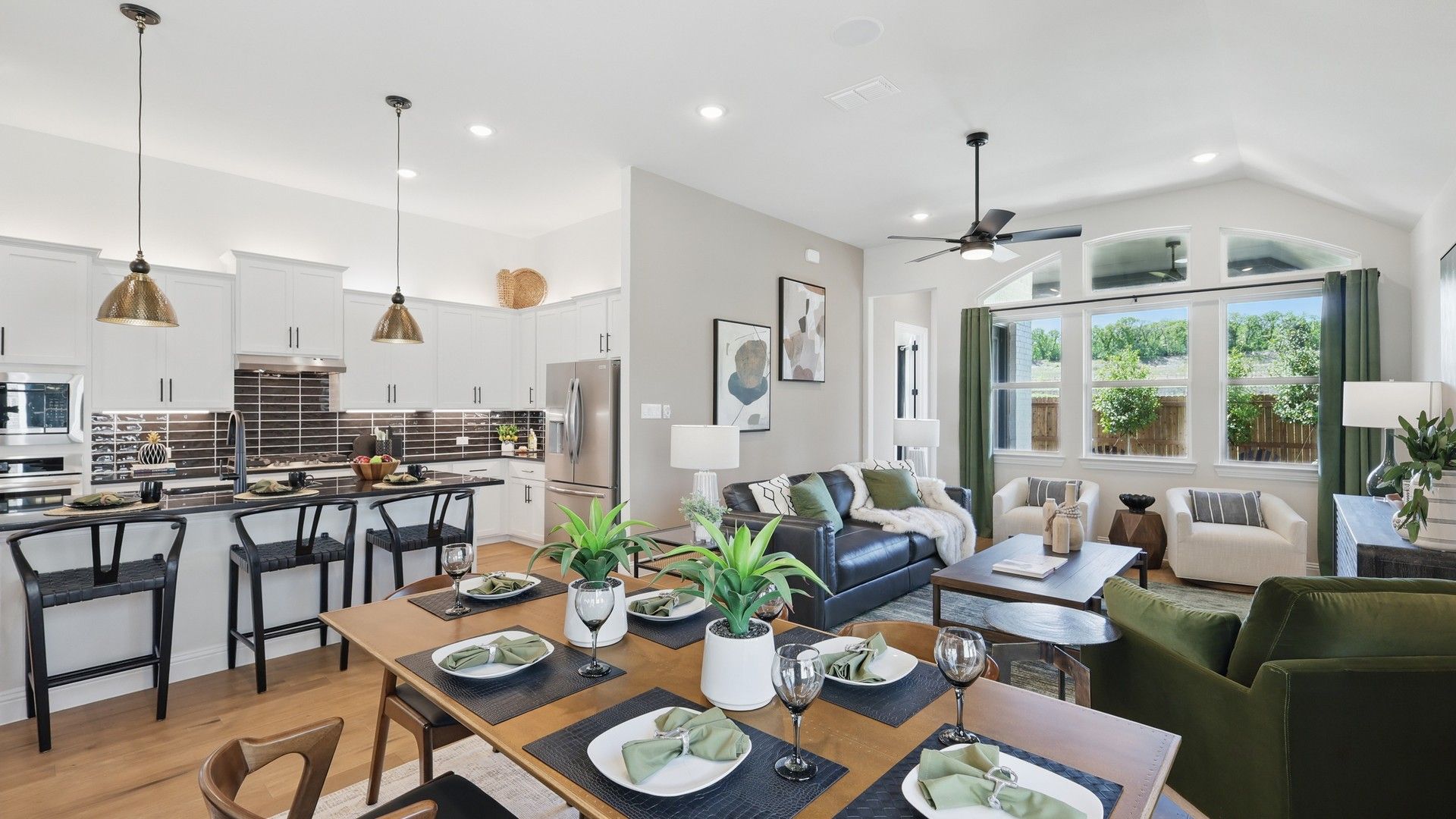 Experience sophistication with modern fixtures and a vaulted ceiling in Green Oaks Preserve.