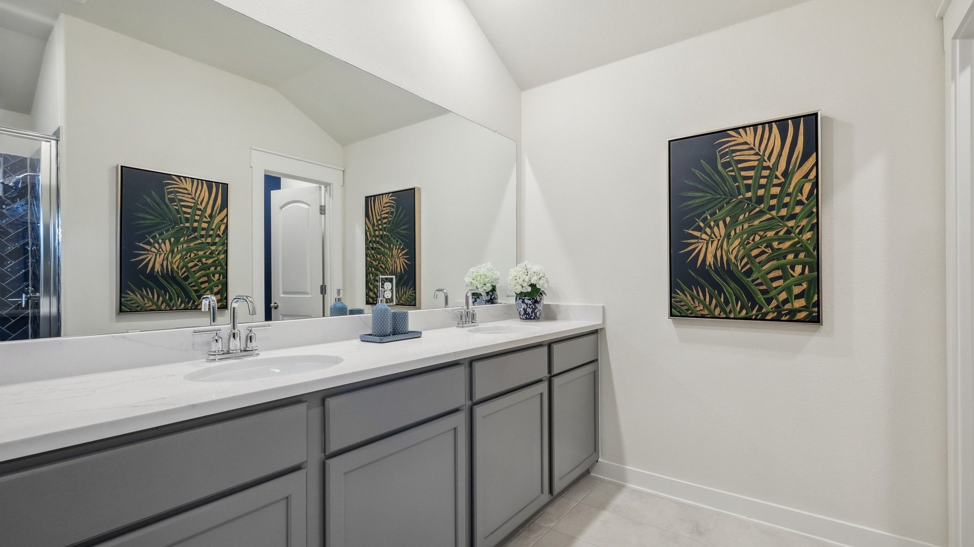 Sophisticated dual-sink vanity with elegant marble finish and custom cabinetry in Churchill community.