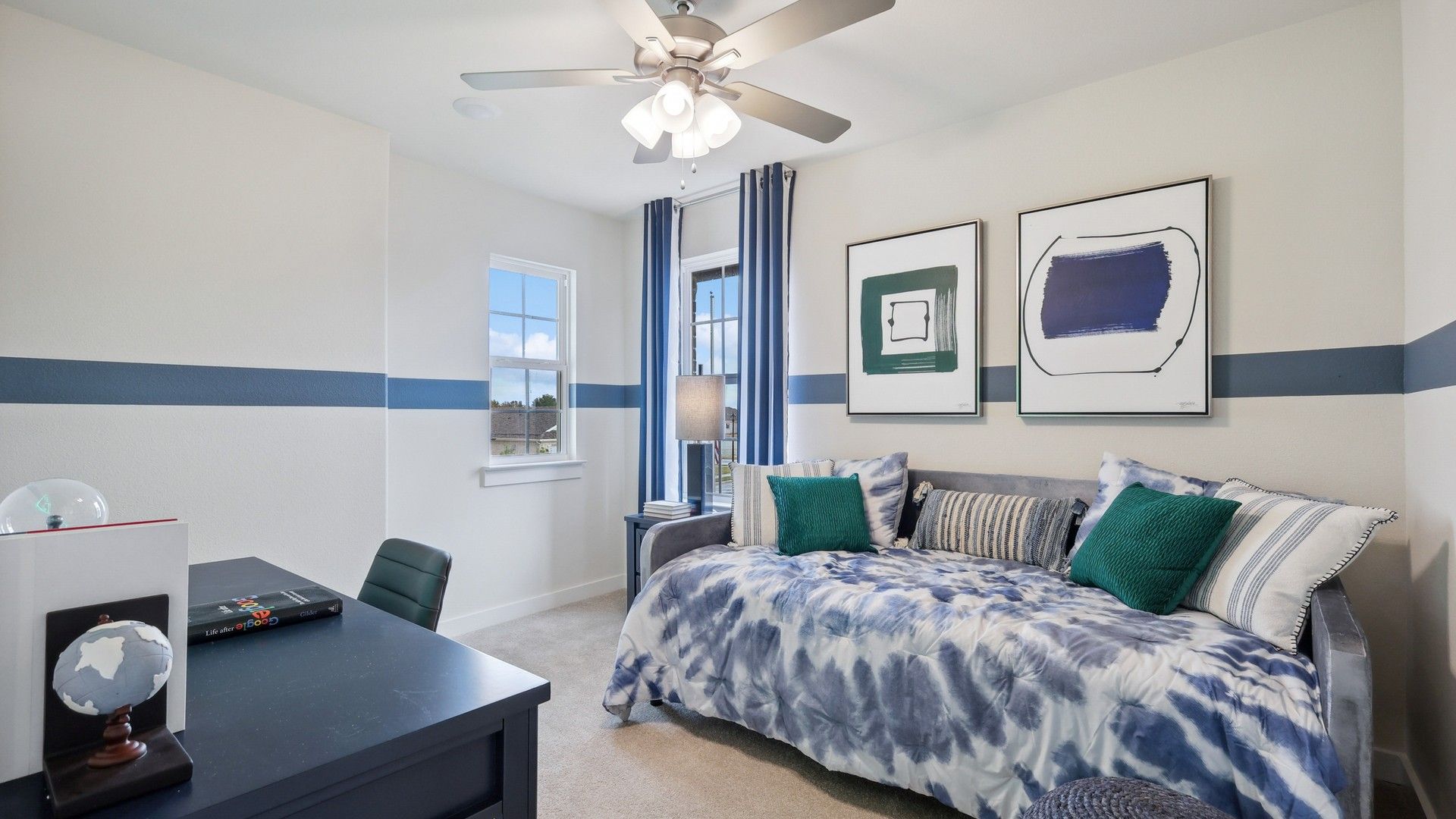 Experience the cool elegance of blue-striped decor and plush bedding, complemented by sophisticated artwork in Churchill.