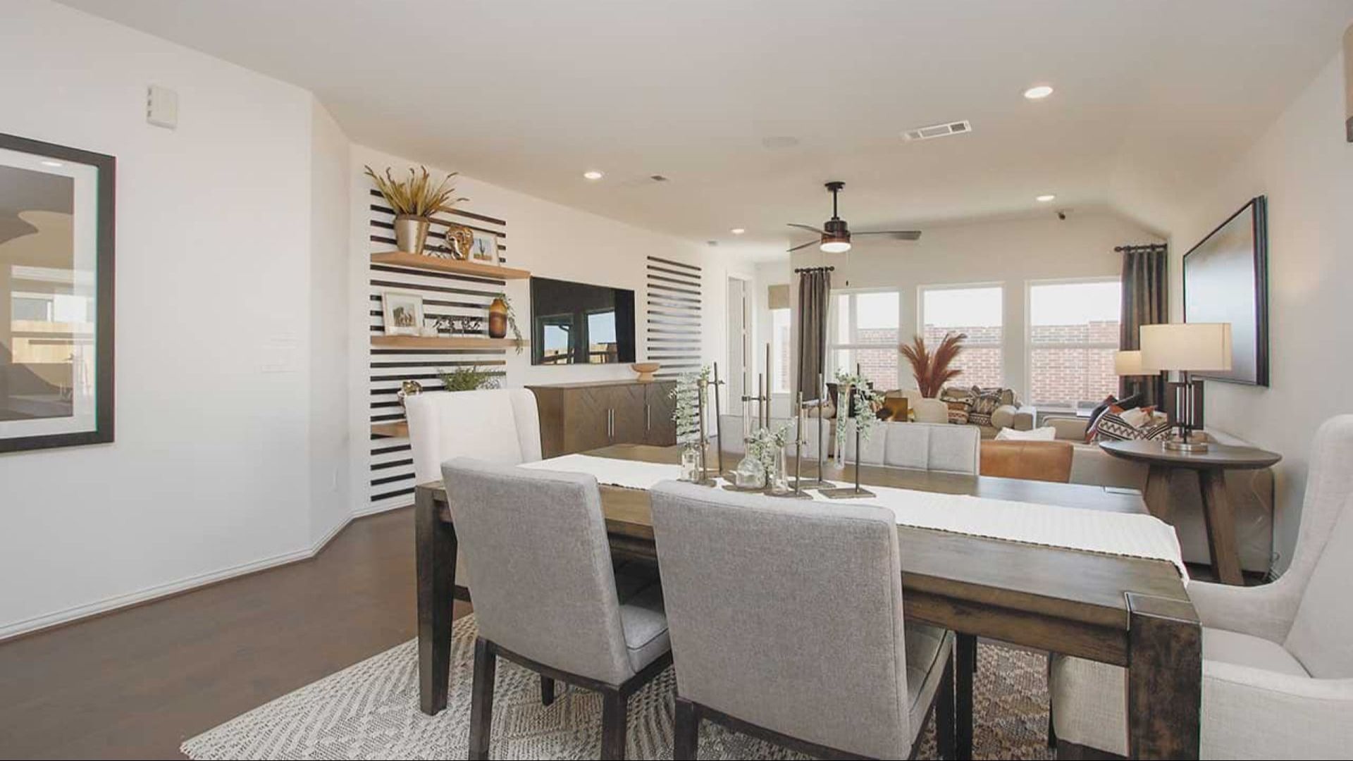 Experience refined elegance with open layout, striped wall accents, and hardwood floors in prestigious Cypress Green.