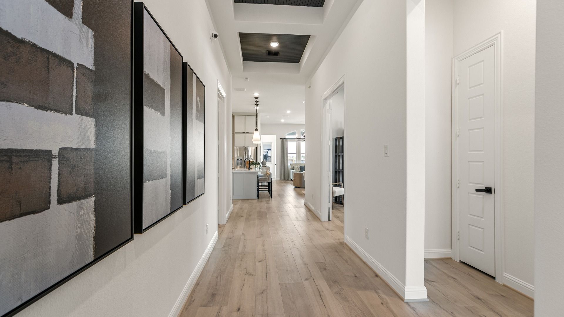 A welcoming entryway flowing directly into the expansive open concept main living space.