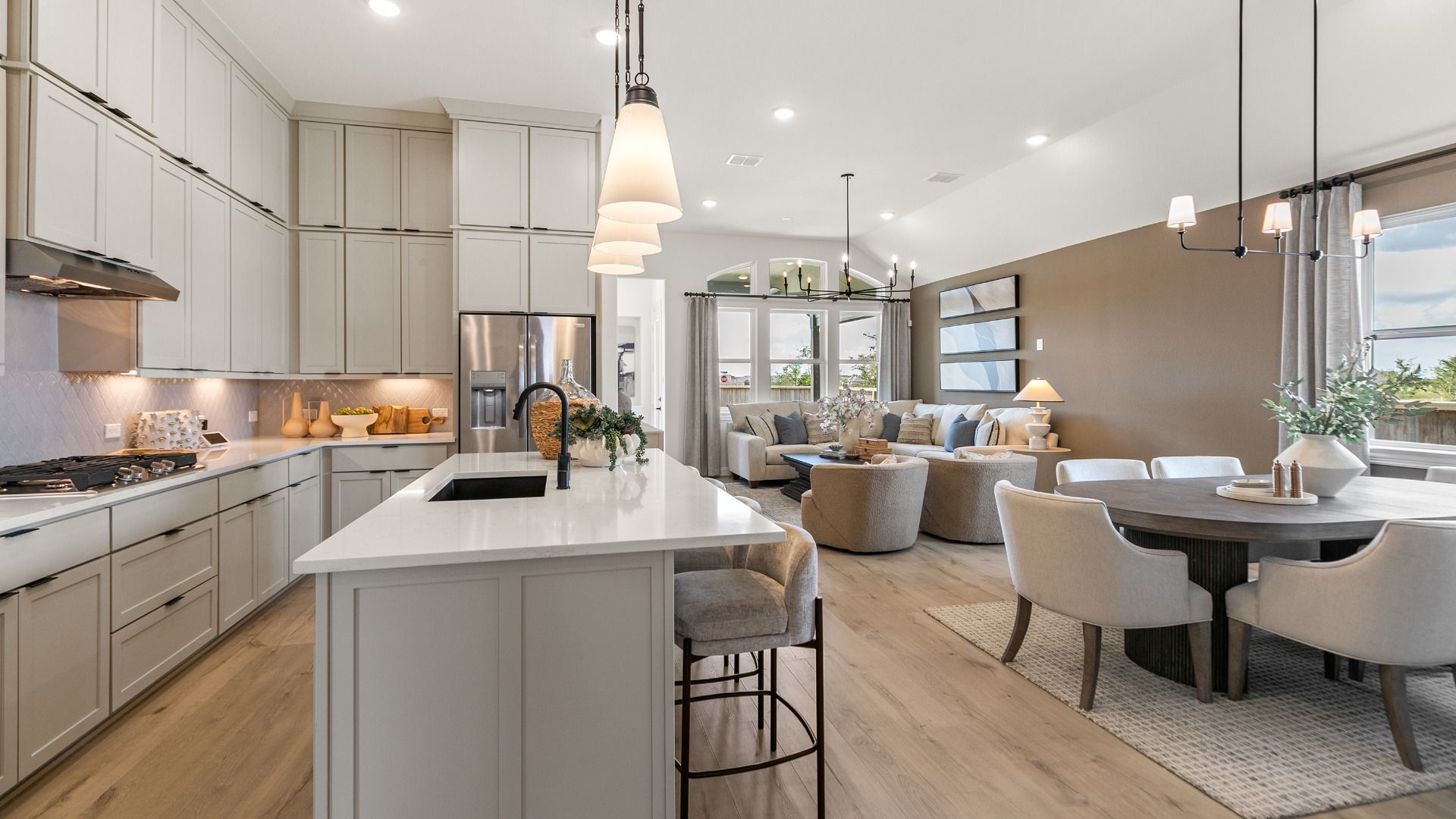 Beautiful open-concept kitchen, dining, and living area perfect for entertaining or everyday living in Westland Ranch.