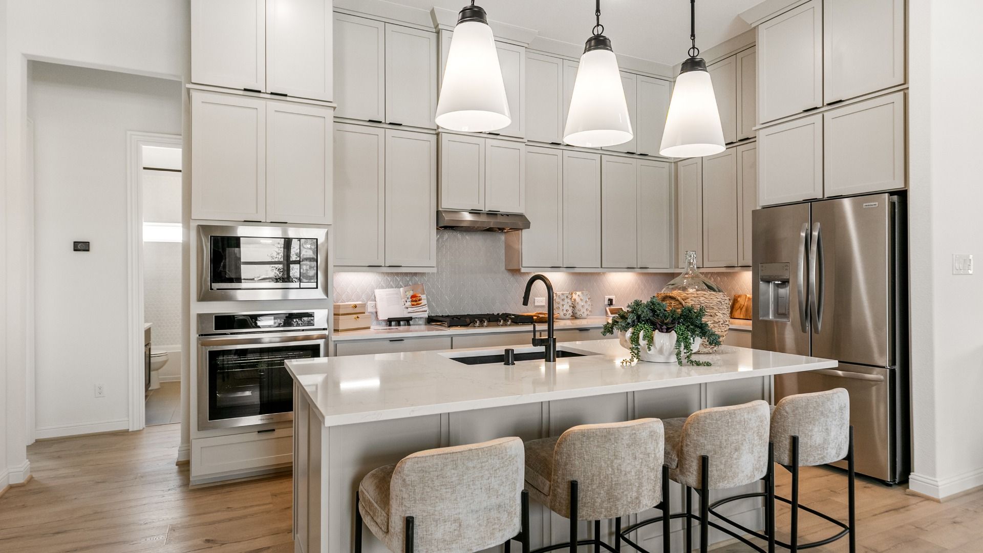 This kitchen features generous cabinetry, providing plenty of room for organization and storage.