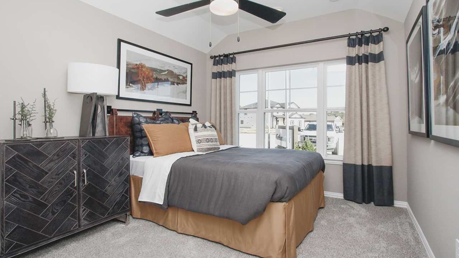 Discover refined elegance with a custom geometric dresser and expansive window views in Cypress Green.