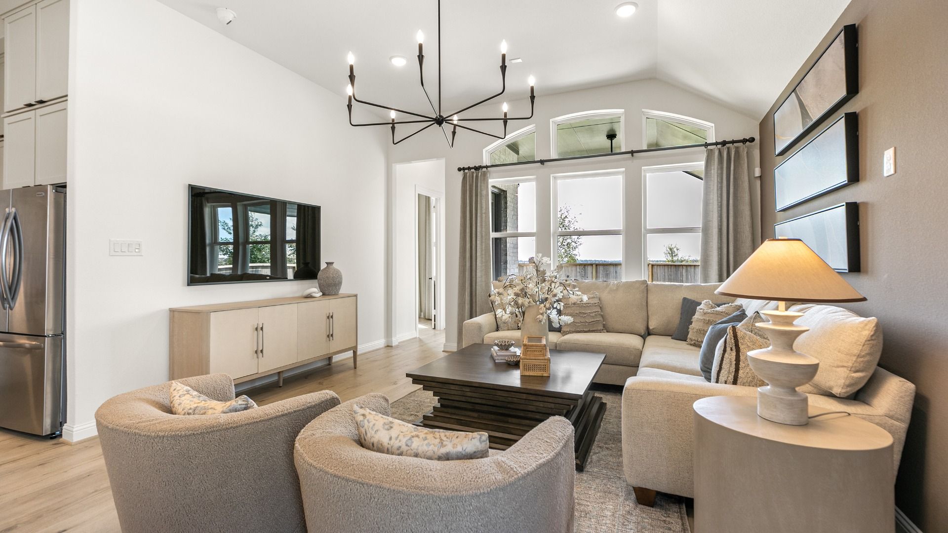 Natural light fills this spacious great room, enhancing its open and welcoming design in Westland Ranch.