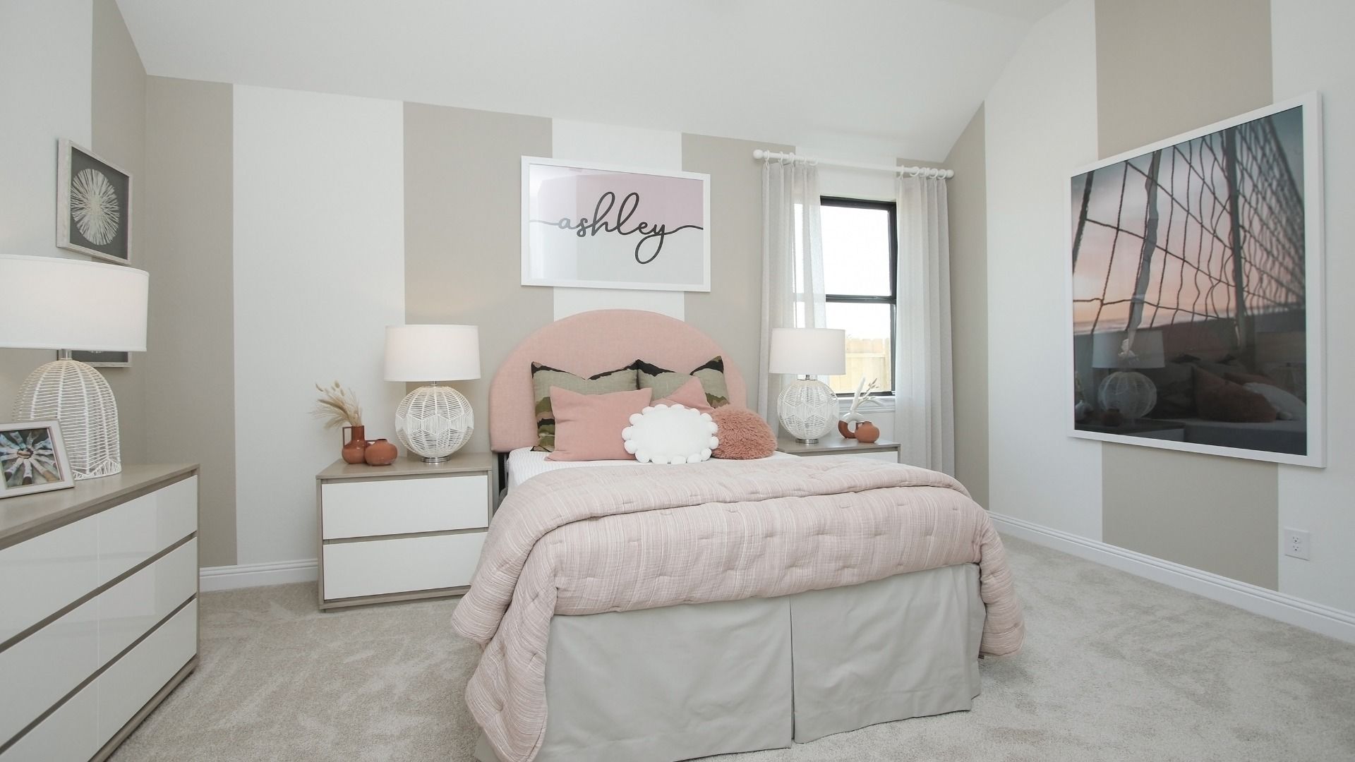 Luxurious Sunterra bedroom features plush bedding, modern accents, and ample natural light for serene living.