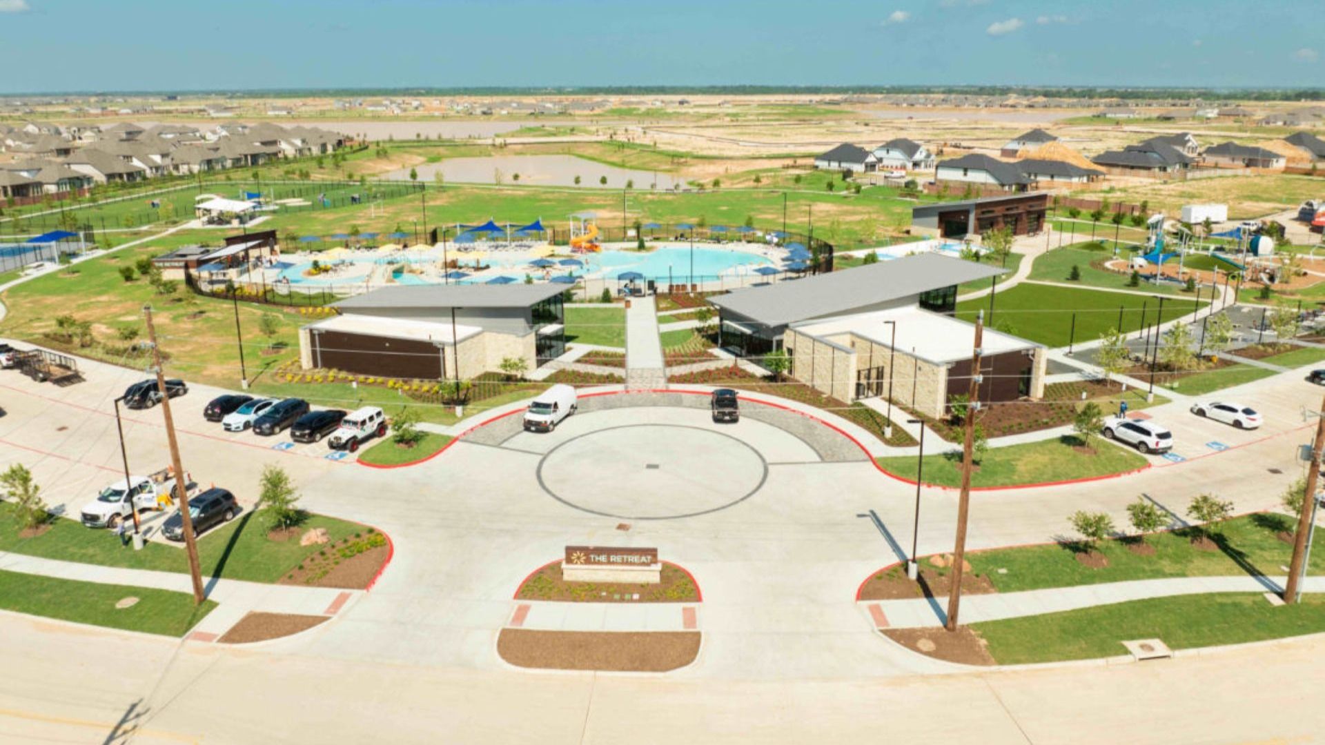Discover Sunterra's sleek clubhouse and resort-style pool surrounded by lush landscapes, epitomizing luxury.