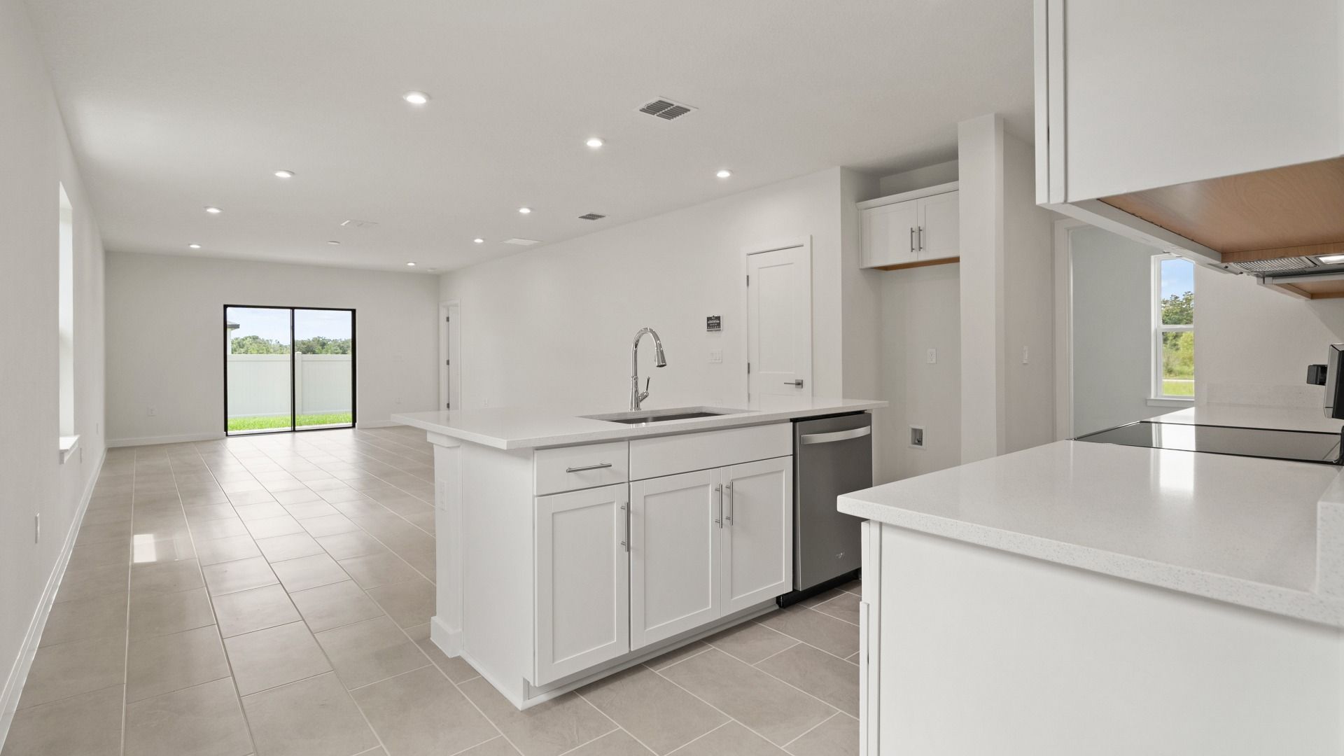 Kitchen Island and view of the living area in the Flagler by DRB Homes in Hamilton Bluff