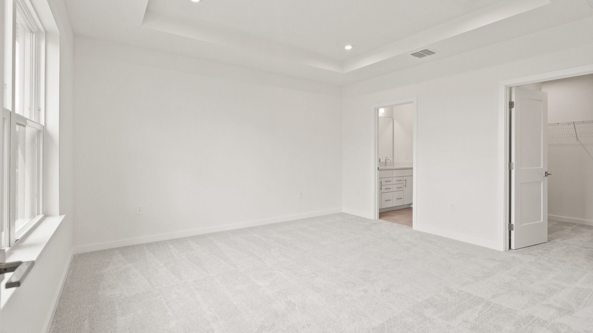 Spacious primary Suite with en suite bath and walk-in closet in the Flagler by DRB Homes in Hamilton Bluff