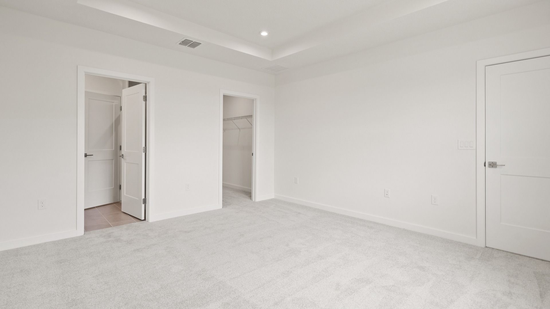 Spacious primary Suite with en suite bath and walk-in closet in the Flagler by DRB Homes in Hamilton Bluff