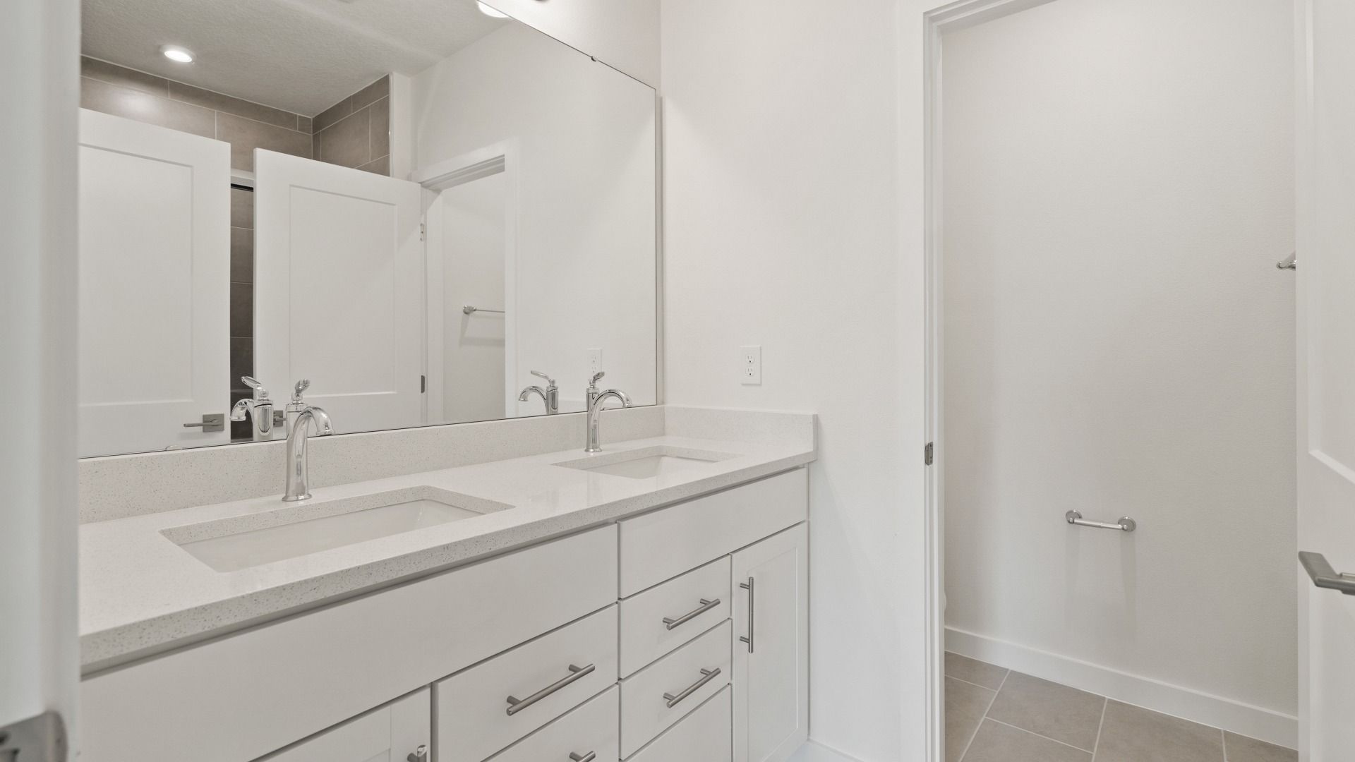 Primary En Suite Bath With Dual Sinks in the Flagler by DRB Homes in Hamilton Bluff