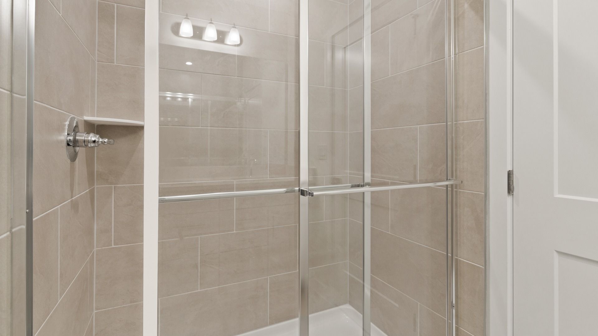Primary En Suite Bath Walk-in Shower in the Flagler by DRB Homes in Hamilton Bluff