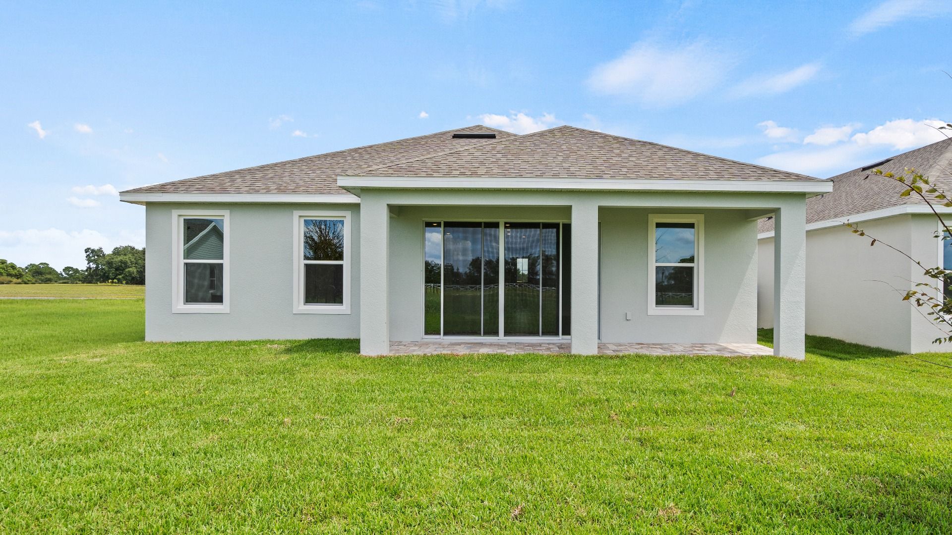 The Rear exterior of the buttonwood in Trailside by DRB Homes in Mount Dora, FL.
