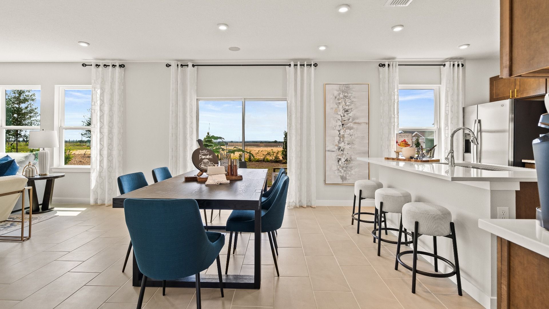 The Dining Area in open concept Model Highbourne by DRB Homes in Hamilton Bluff located in Haines City, FL.