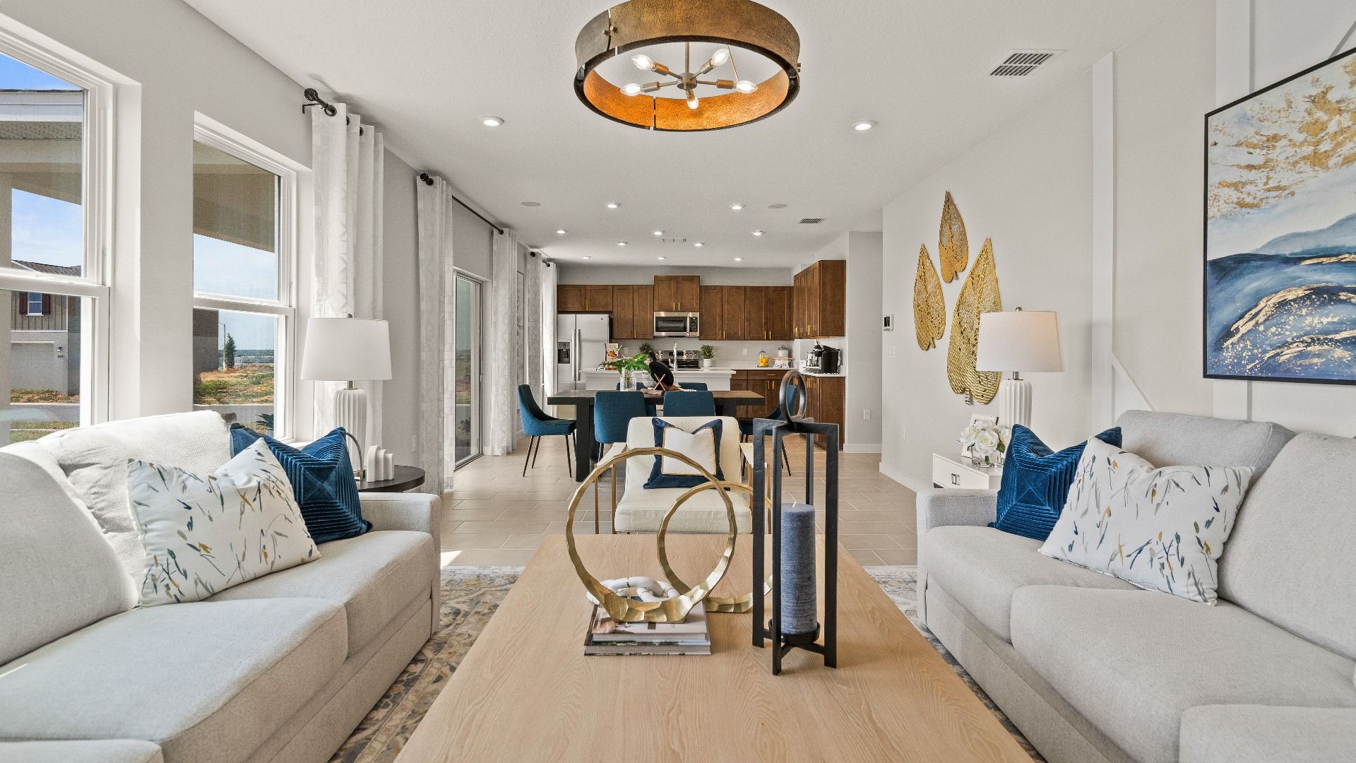 The First Floor Living Area in the Model Highbourne by DRB Homes in Hamilton Bluff located in Haines City, FL.