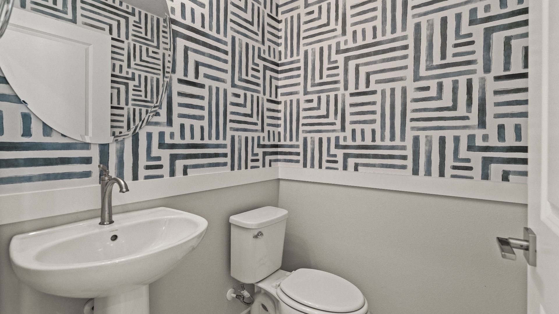 The First Floor Guest Bathroom in the Model Highbourne by DRB Homes in Hamilton Bluff located in Haines City, FL.