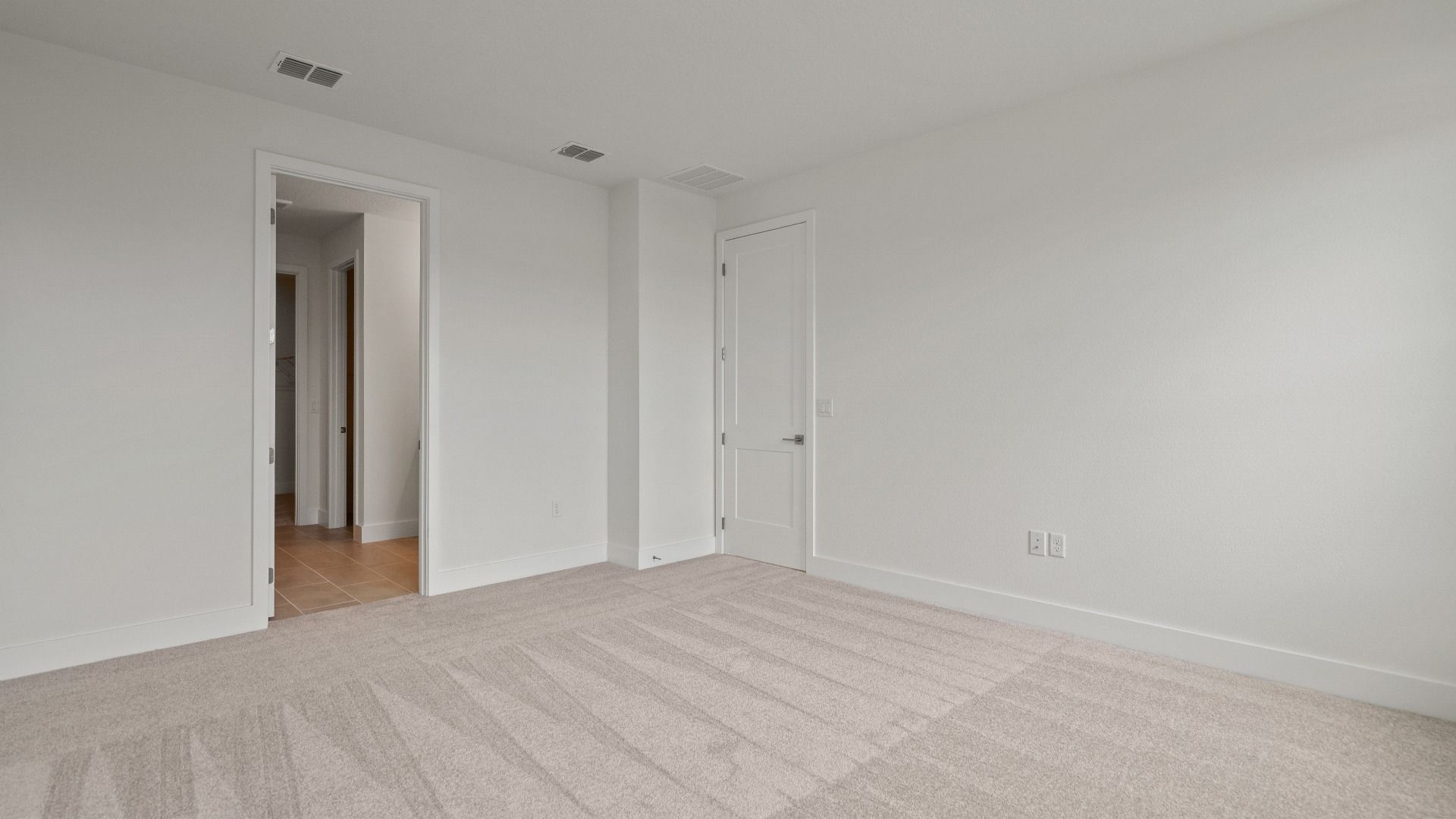 The Primary Suite of the Buttonwood by DRB Homes at Trailside in Mount Dora, FL.