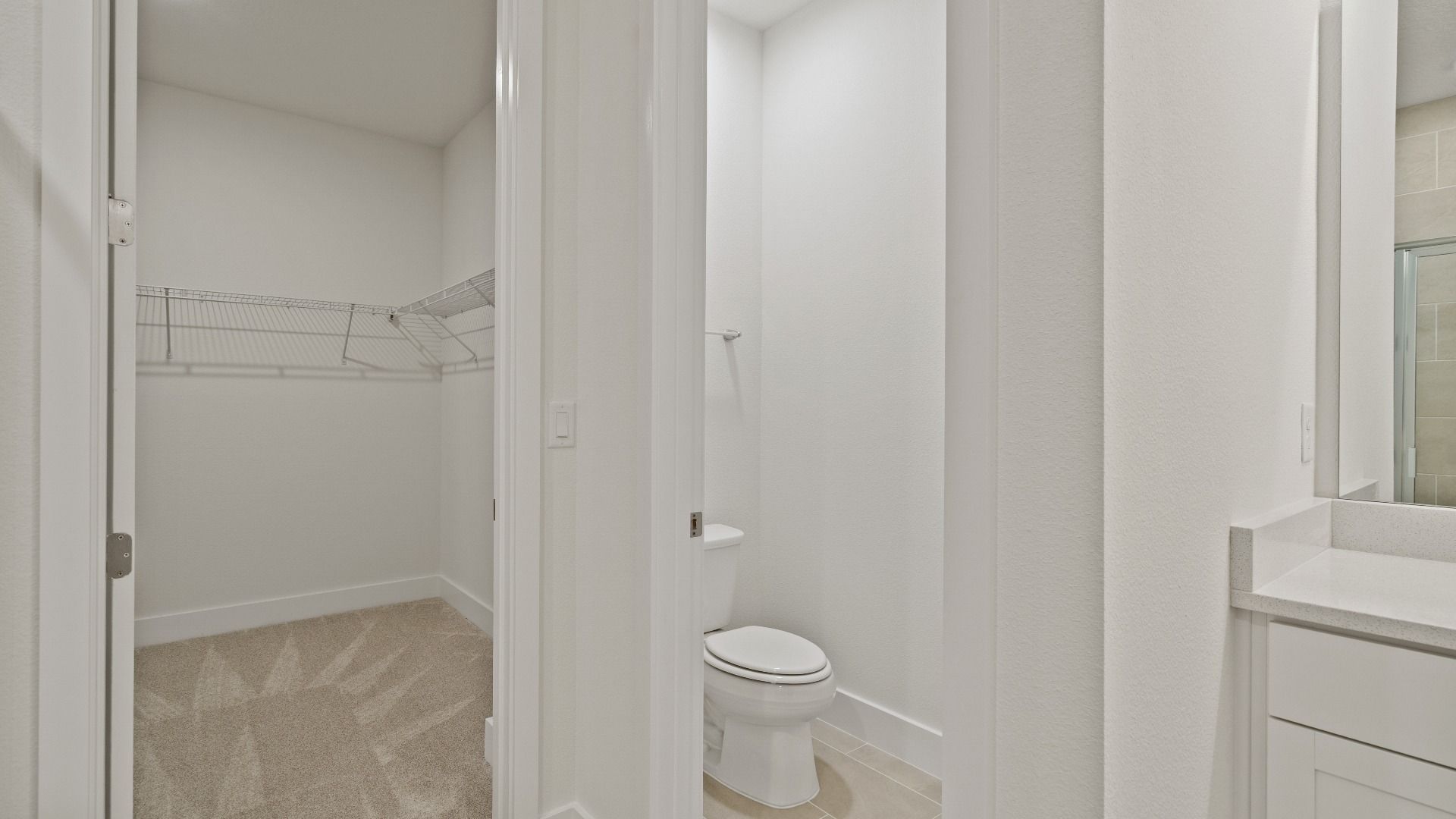 The Primary Walk-in Closet of the Buttonwood by DRB Homes at Trailside in Mount Dora, FL.