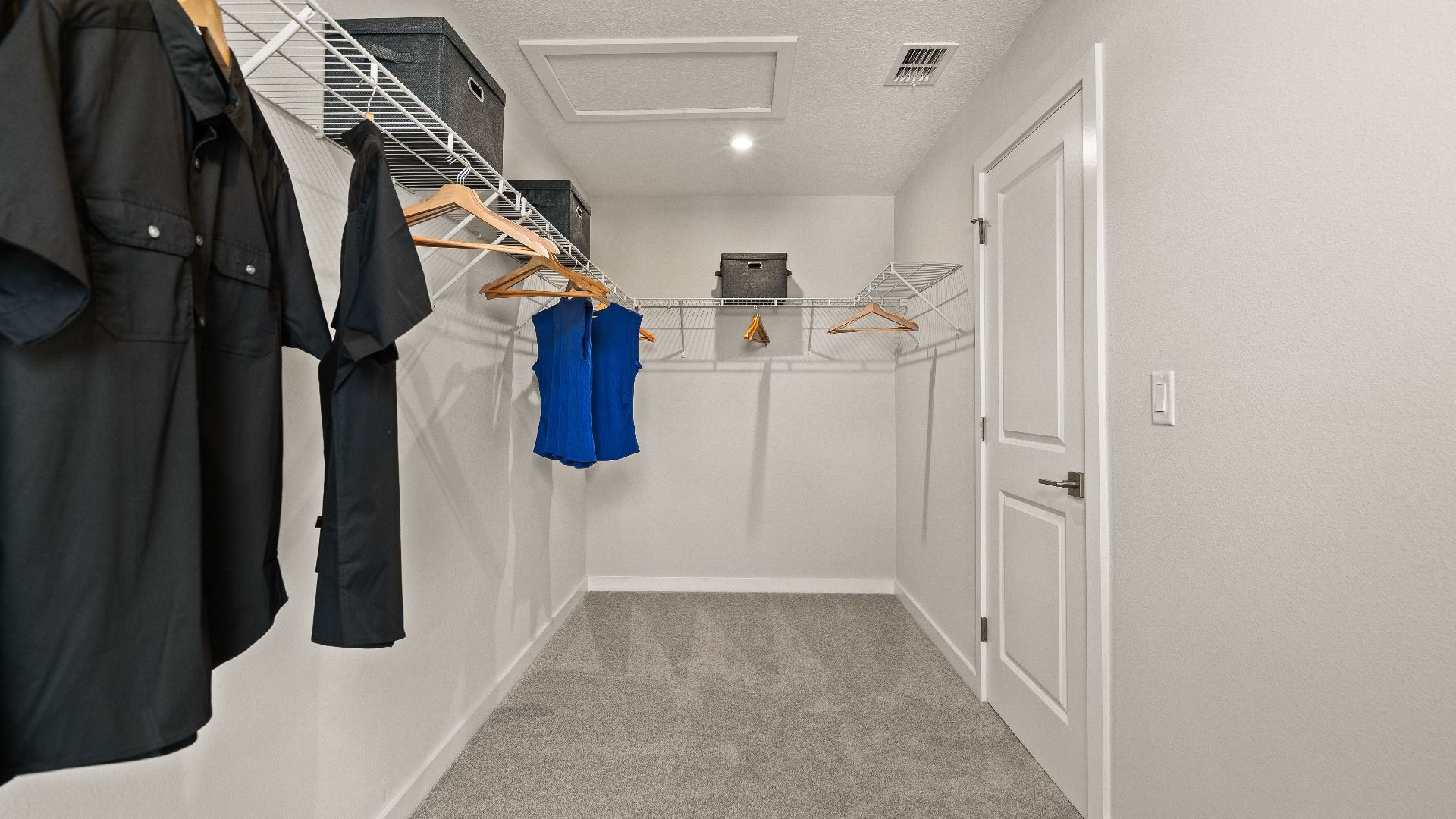 Primary Suite Walk-in Closet in the Model Highbourne by DRB Homes in Hamilton Bluff located in Haines City, FL.