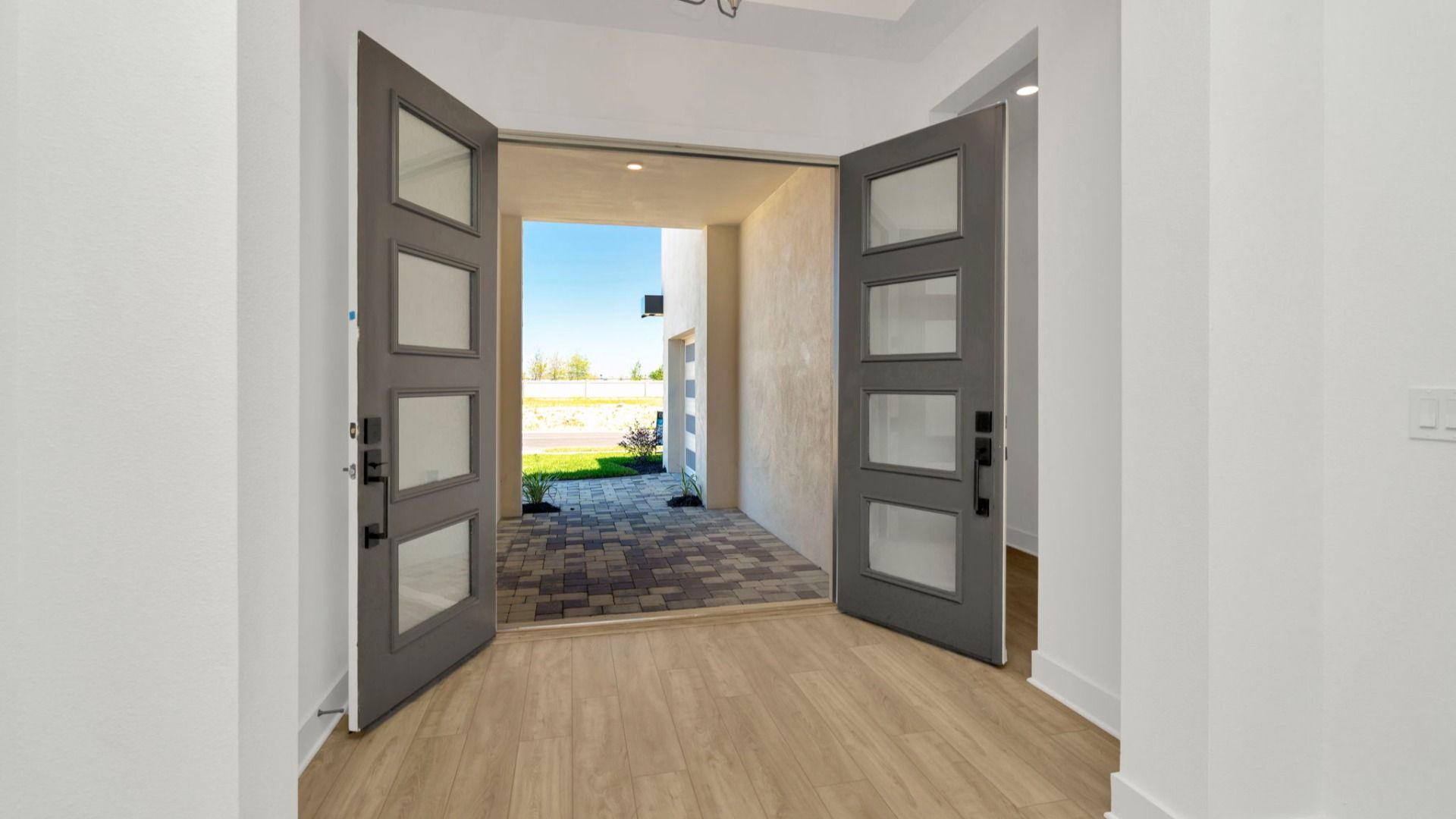 The Front Door of a DRB Homes Grand Hawk which is offered as a home plan at Serengeti in Spring Hill, FL.