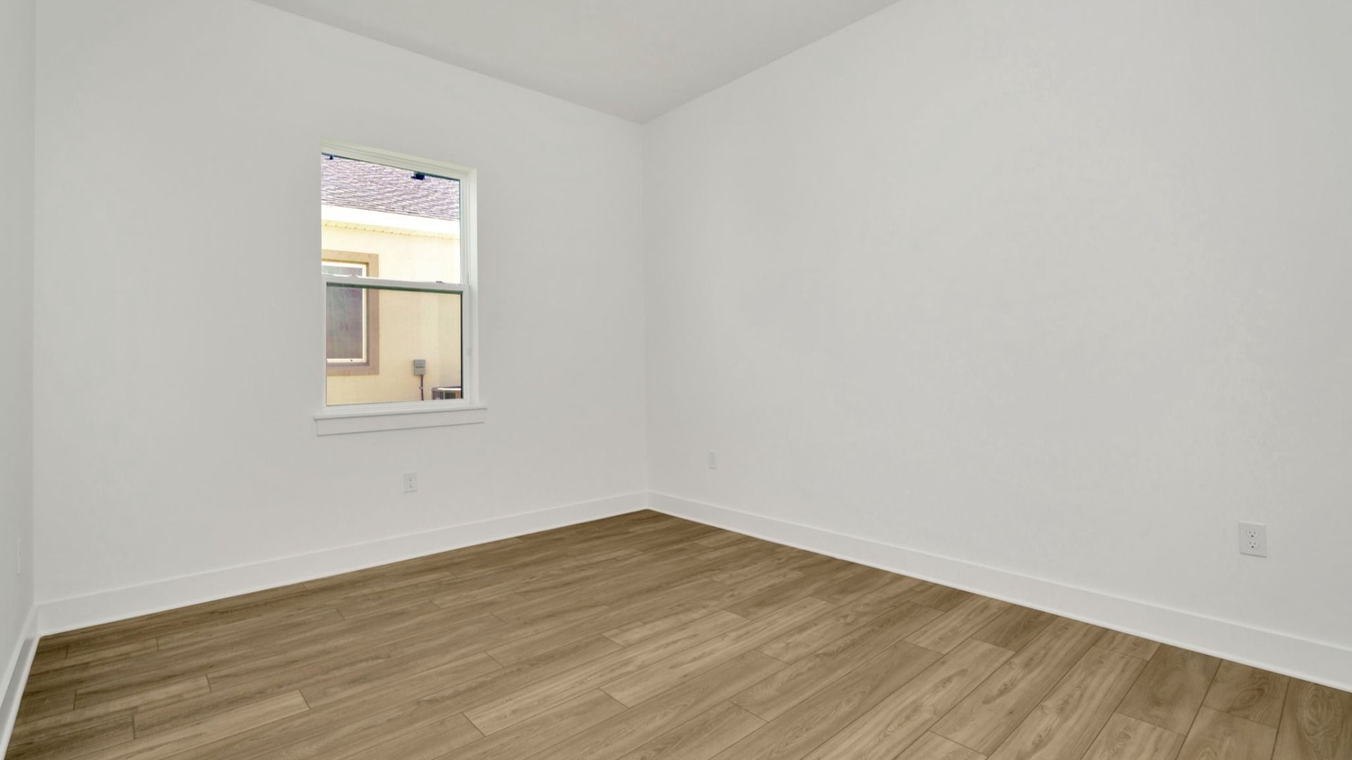 The Third Bedroom of a DRB Homes Grand Hawk which is offered as a home plan at Serengeti in Spring Hill, FL.