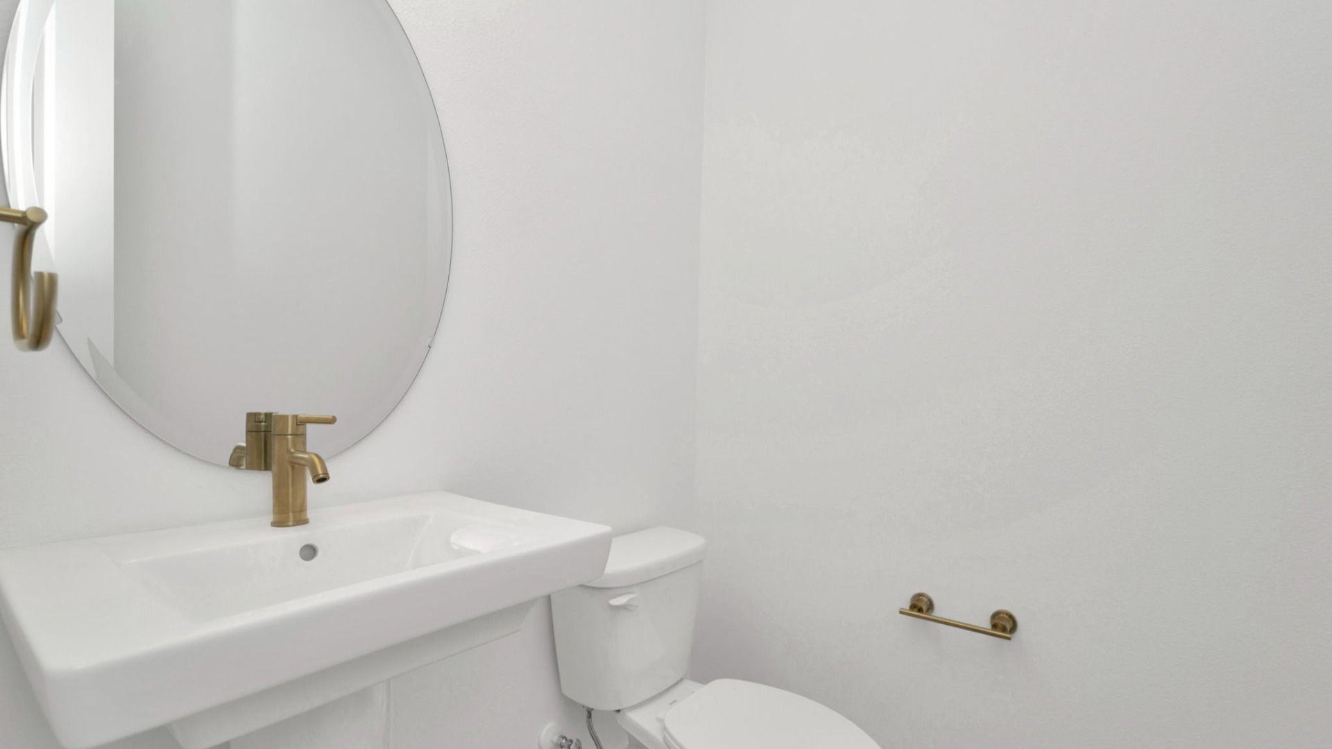 The Half Bathroom of a DRB Homes Grand Hawk which is offered as a home plan at Serengeti in Spring Hill, FL.