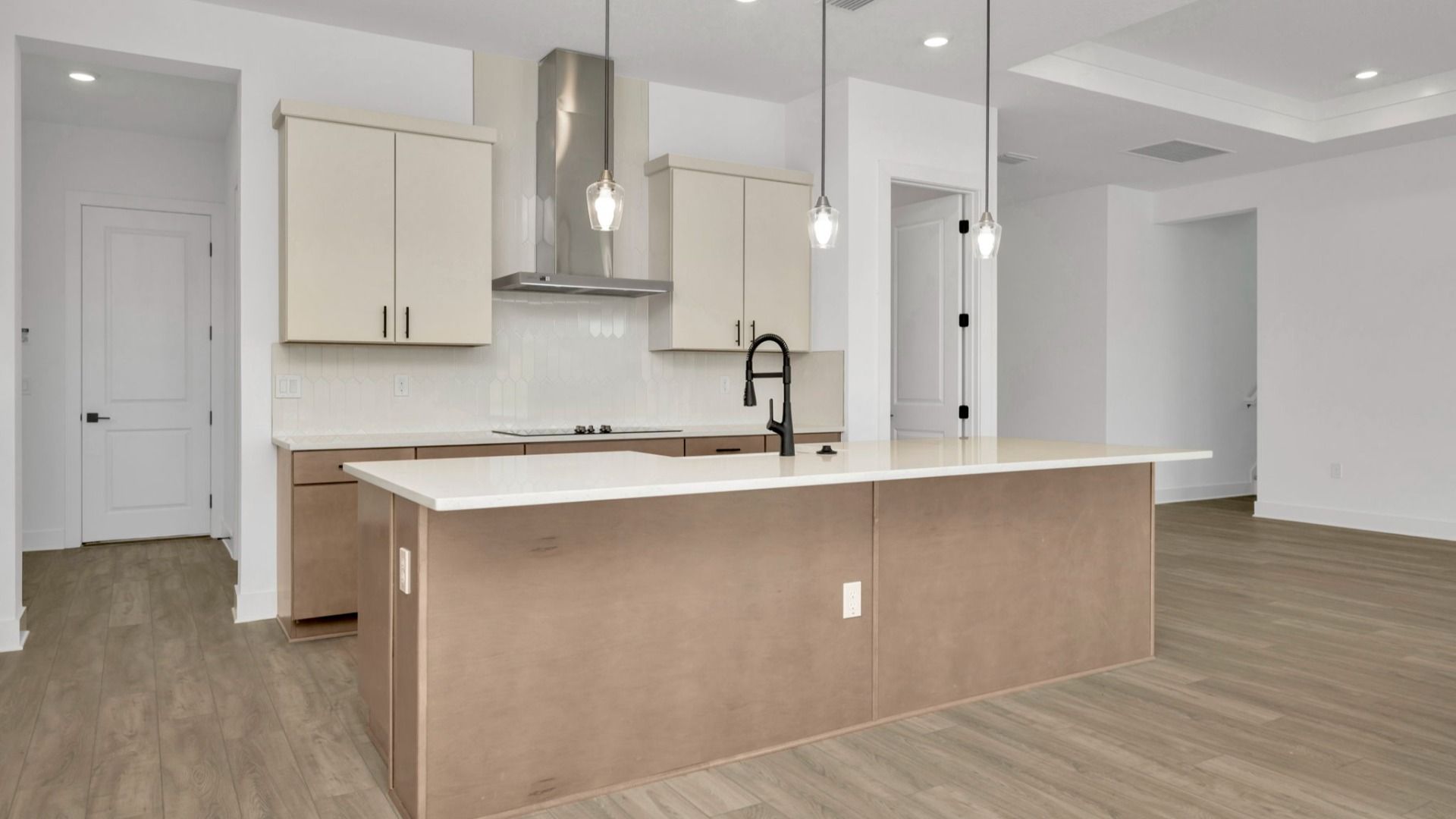 The Kitchen of a DRB Homes Grand Hawk which is offered as a home plan at Serengeti in Spring Hill, FL.
