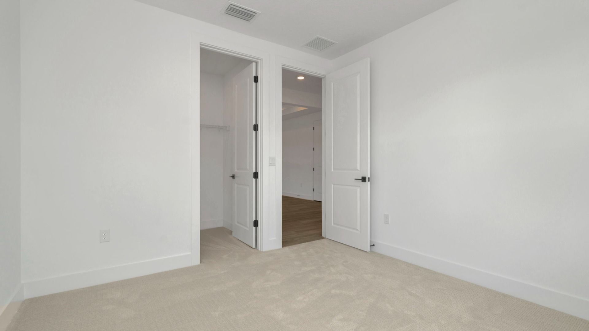 The Fourth Bedroom of a DRB Homes Grand Hawk which is offered as a home plan at Serengeti in Spring Hill, FL.