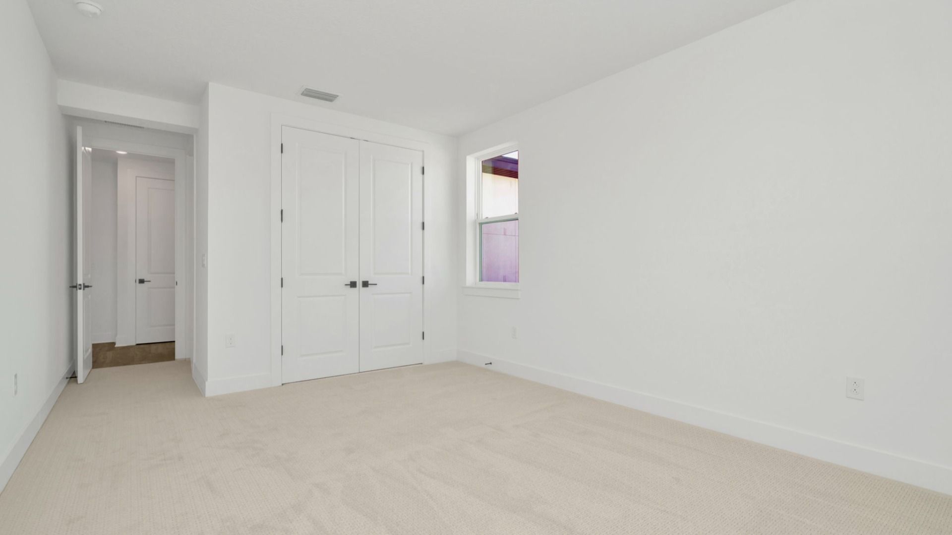 The Sixth Bedroom of a DRB Homes Grand Hawk which is offered as a home plan at Serengeti in Spring Hill, FL.