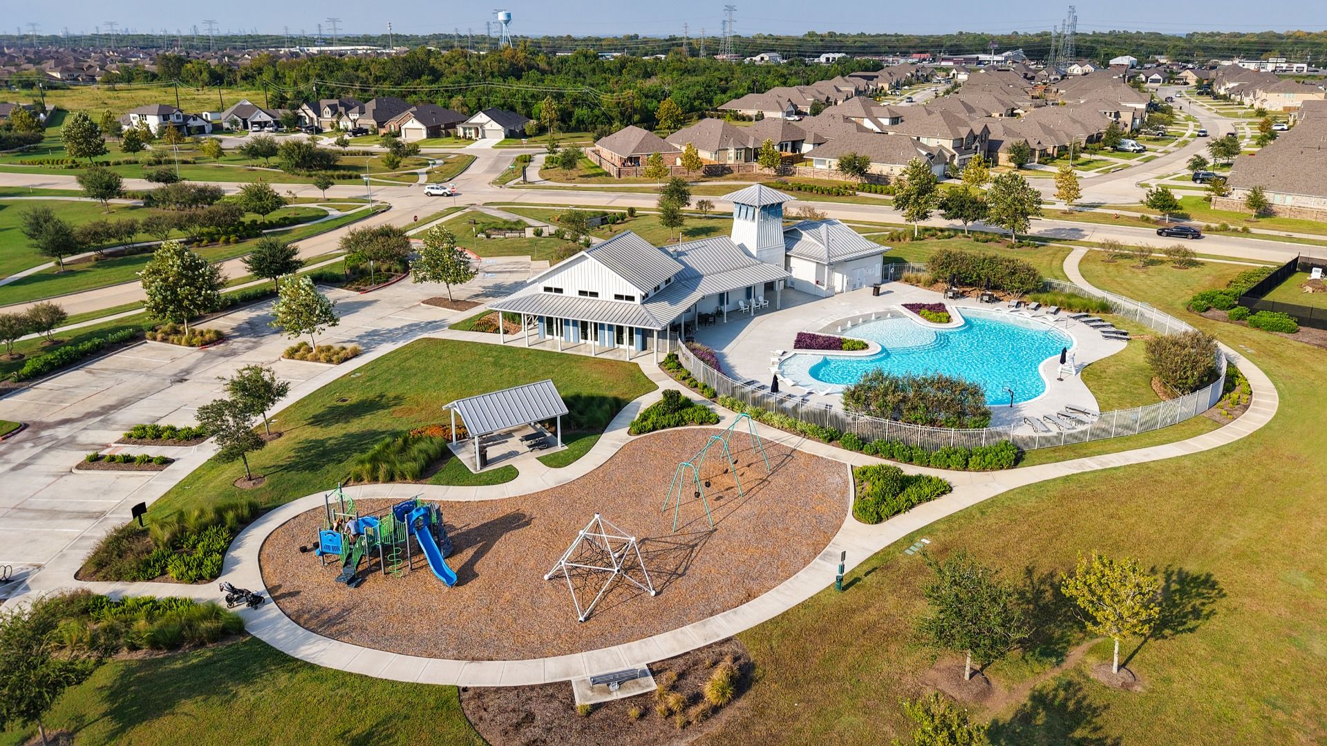Elegant clubhouse with resort-style pool and playground in League City’s Coastal Point community.