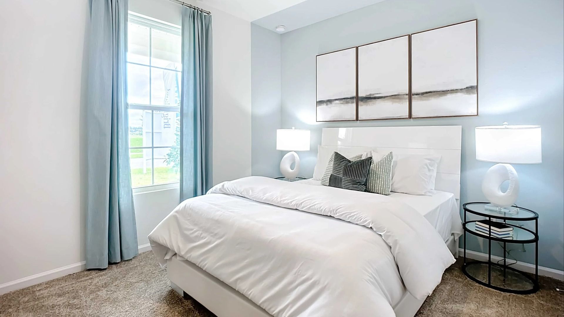 Luxurious bedroom features serene blue walls and plush carpet, offering tranquil elegance in Panther Creek.