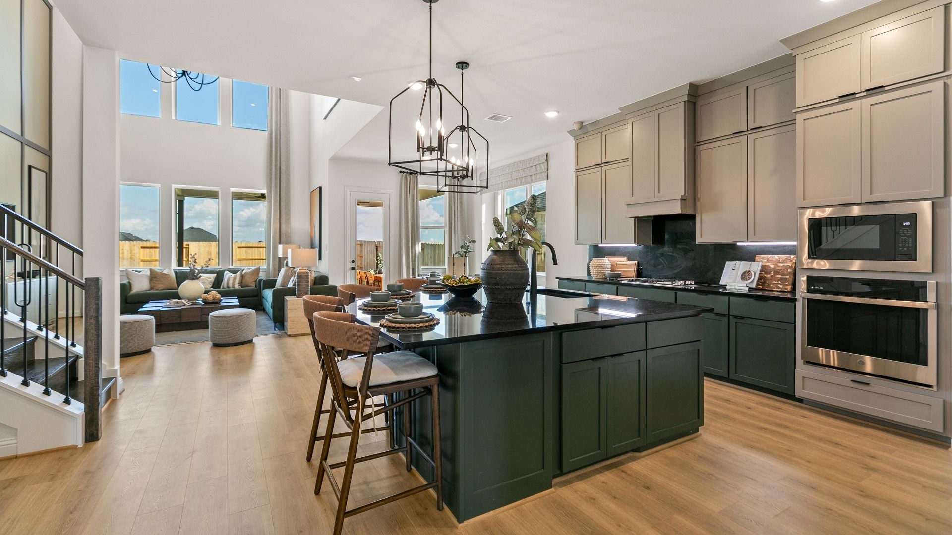 The kitchen opens up to the dining and living areas in this elevated home.