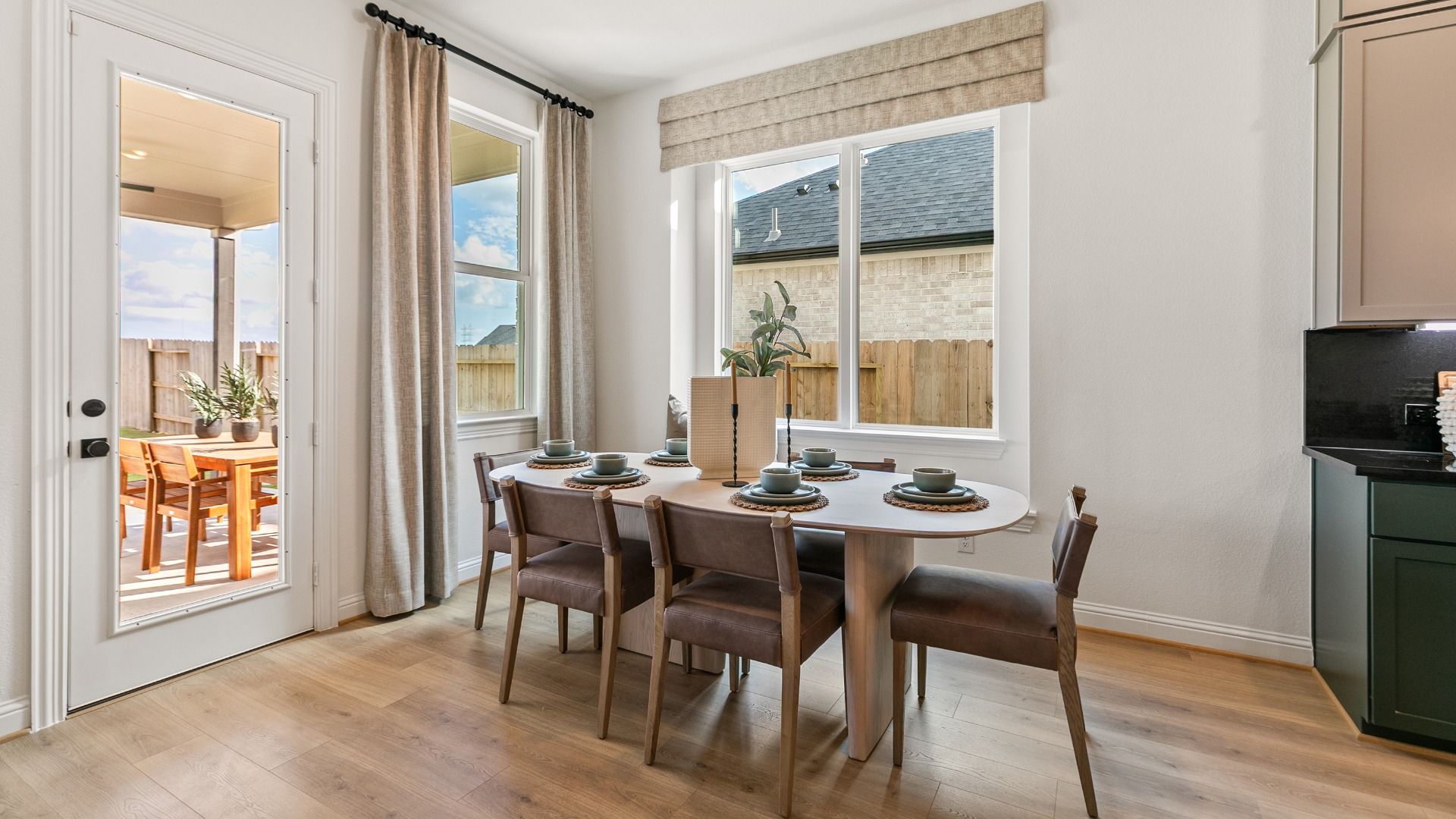 This home has a light-filled casual dining area with direct access to the covered patio.