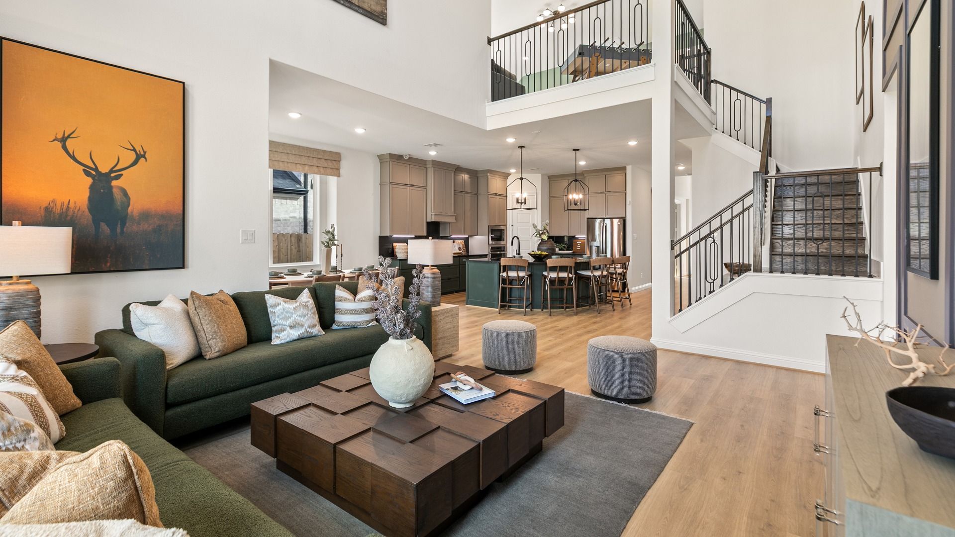 Staircase detail and soaring ceilings elevate this family living area in Creekhaven.