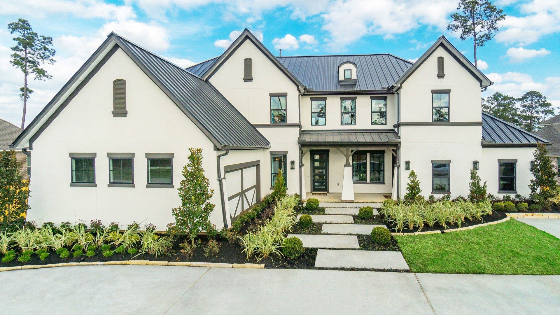 Experience refined living in Mostyn Manor Reserve with sleek white exteriors and a contemporary black roof.