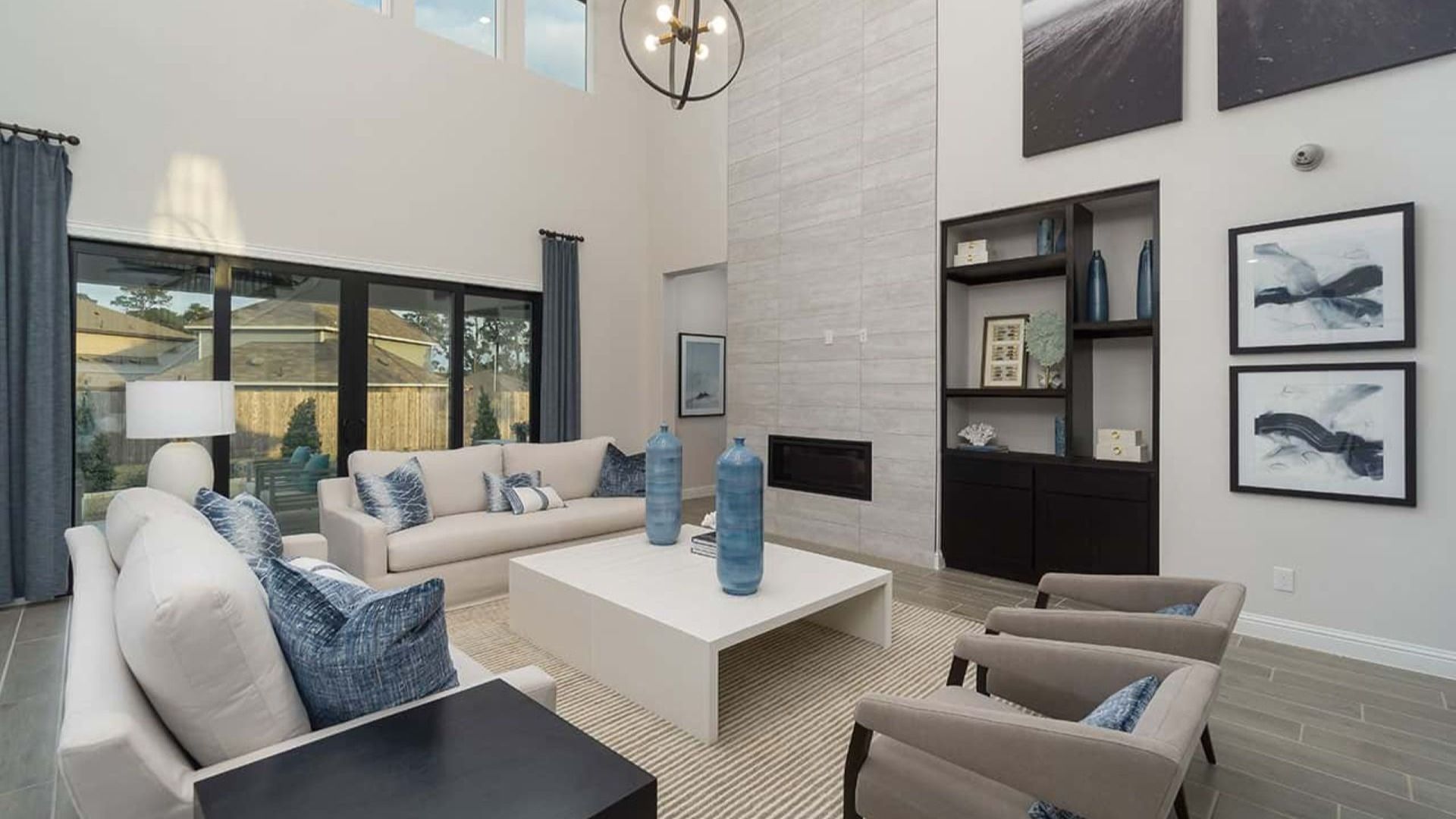 Experience luxury with high ceilings, sleek fireplace, and elegant decor in Mostyn Manor Reserve.