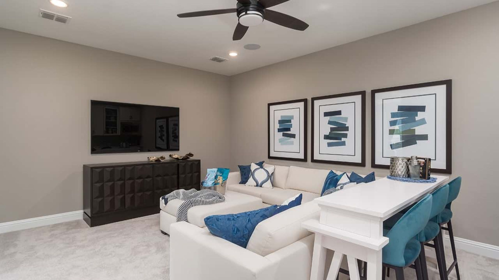 Elegant living space in Mostyn Manor Reserve featuring custom cabinetry and chic design.