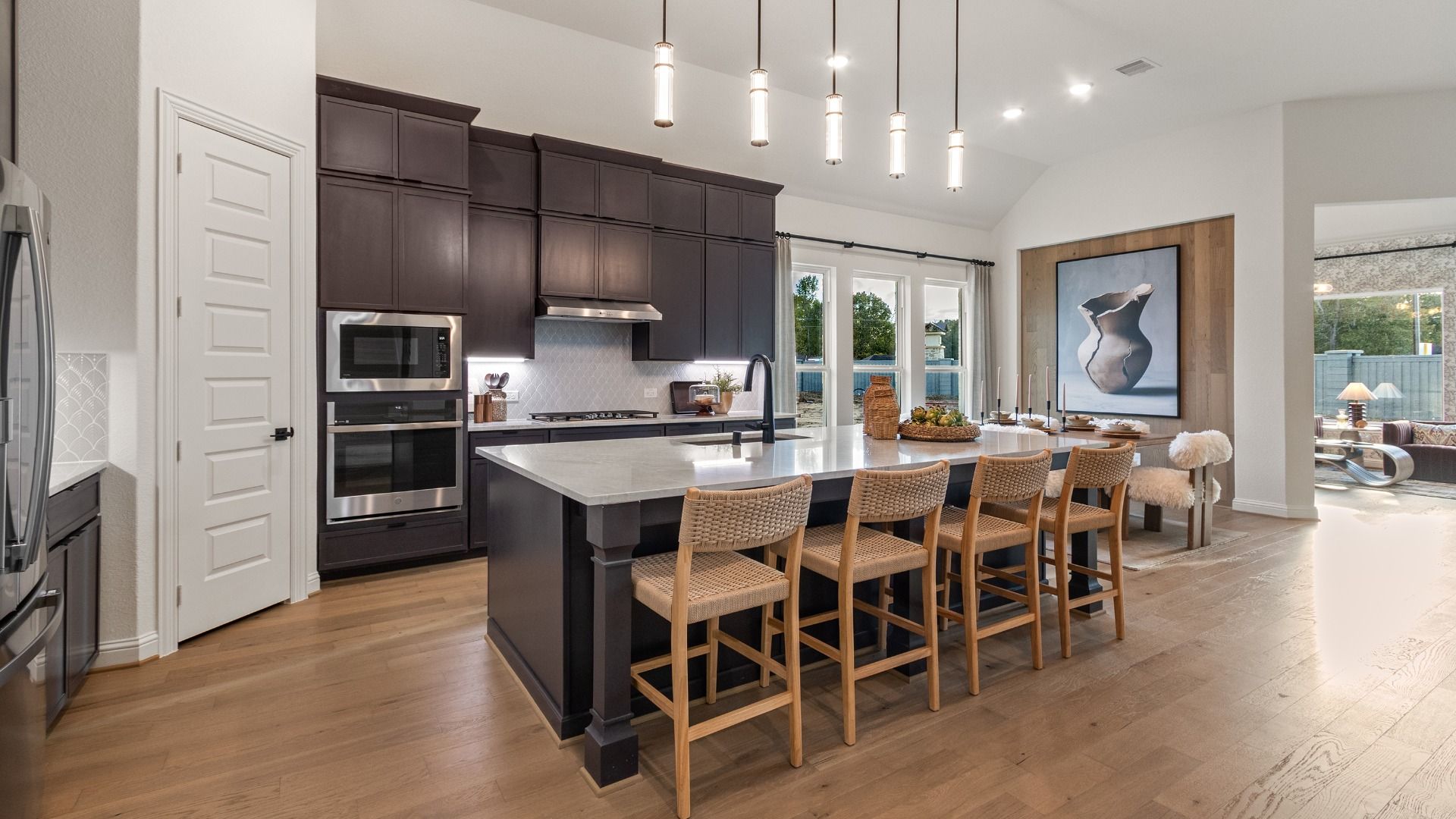 This spacious kitchen features an oversized island that offers plenty of room for meal prep and casual seating.
