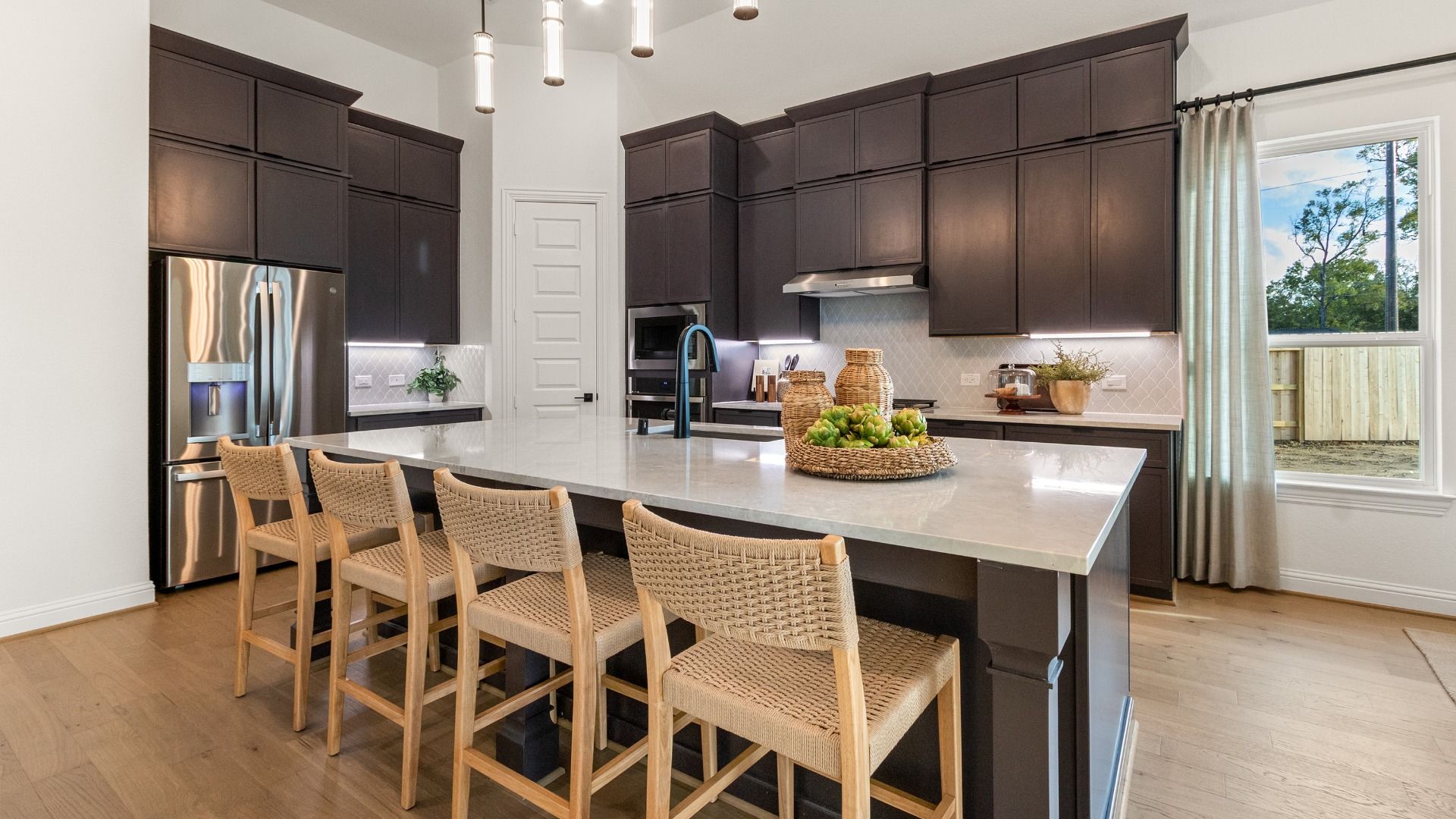 Thoughtfully crafted with abundant storage and sleek countertops, this modern kitchen is built for everyday living.