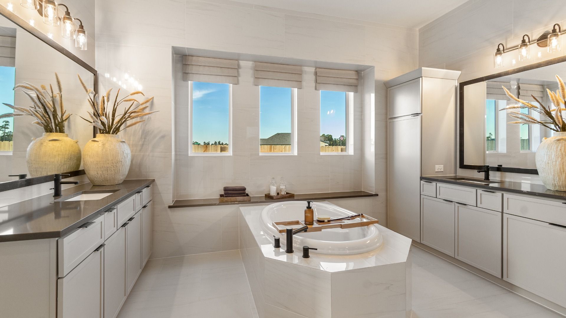 Relax in Style in the Spa-Inspired Primary Bath with beautiful natural light.