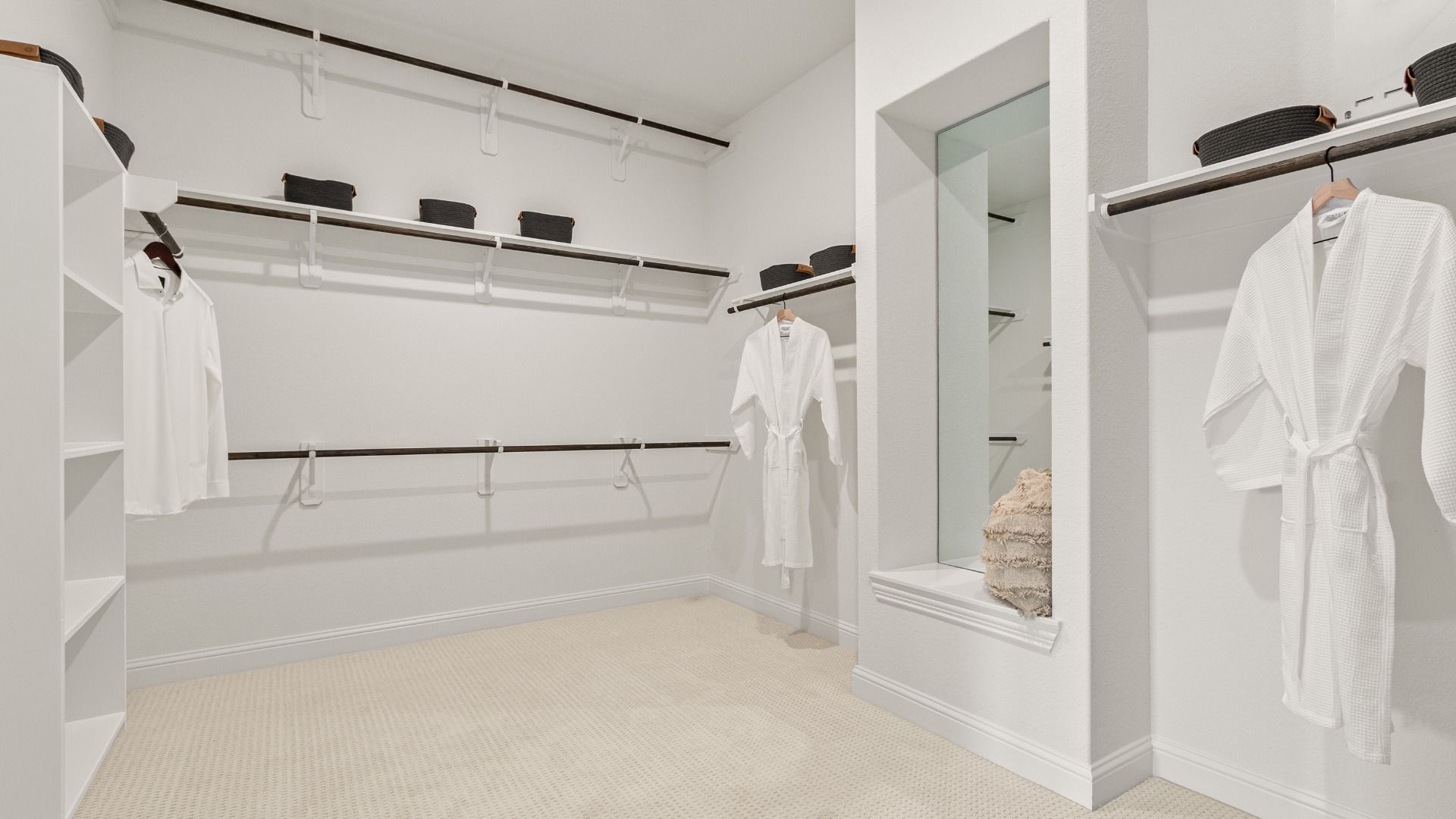 Expansive primary closet provides the space you need to keep your wardrobe neatly organized.