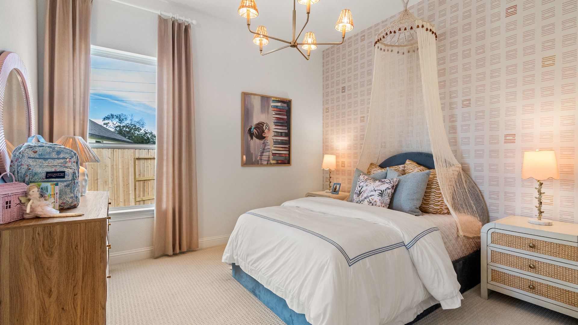 A stylish wallpaper accent wall adds character and charm to this dreamy secondary bedroom retreat.