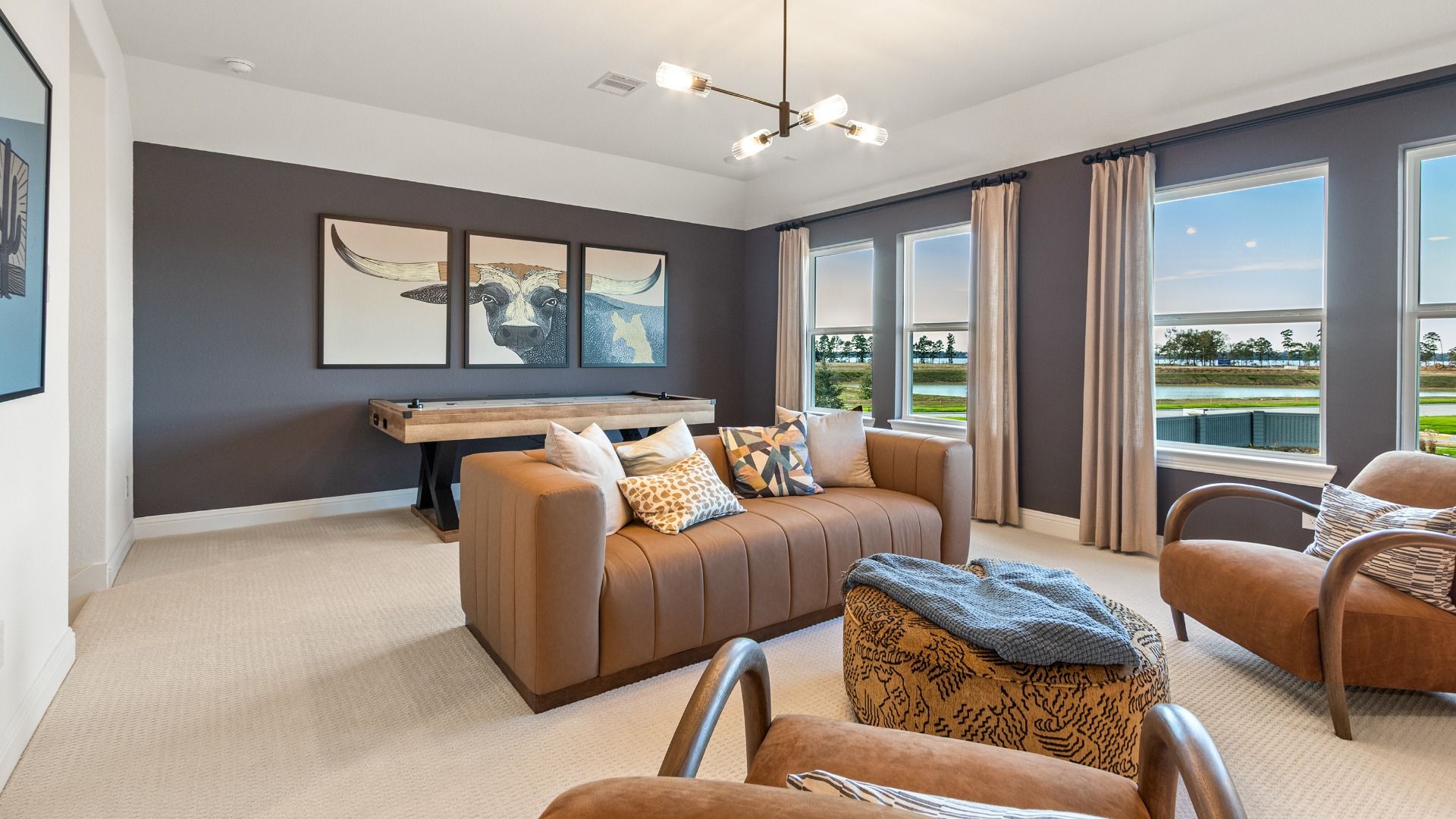 A spacious game room offering additional living space and beautiful views in Sundance Cove.