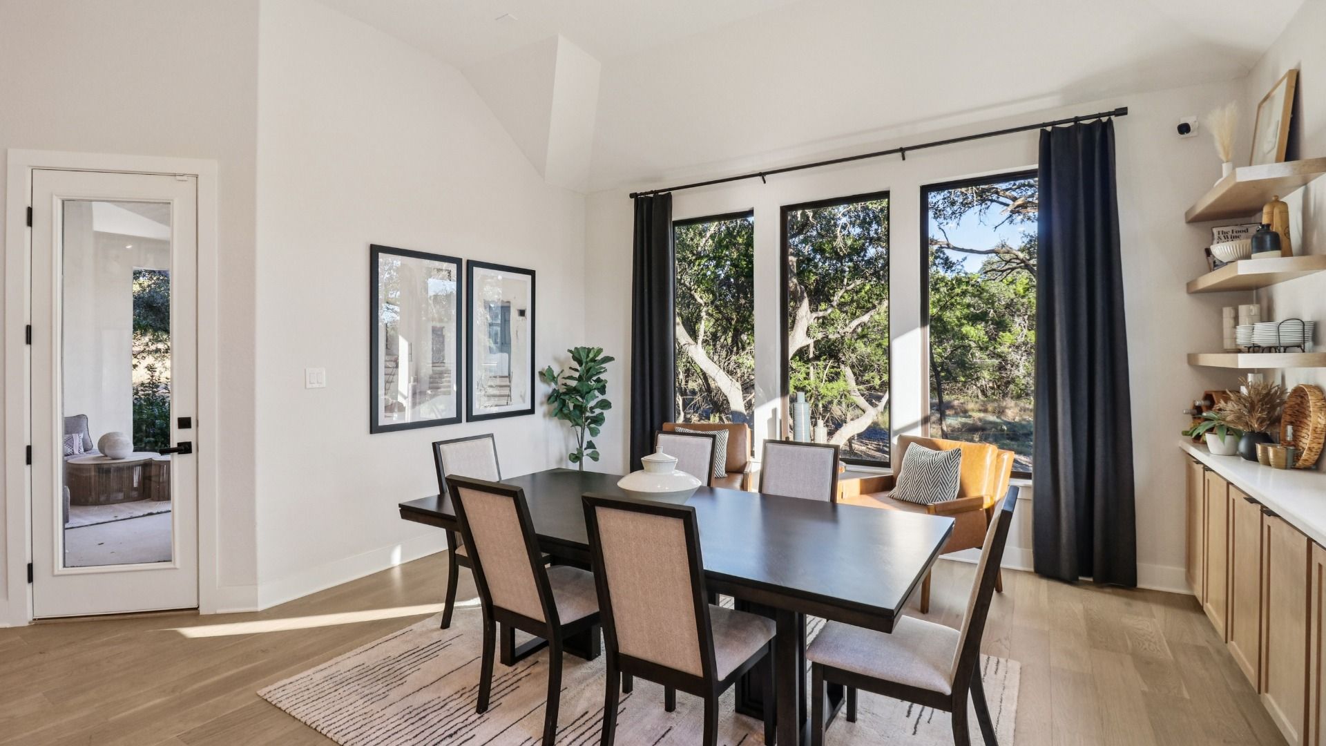Elegant kitchen with custom wood cabinets, expansive island, and chic pendant lights in Verandas at the Rim.