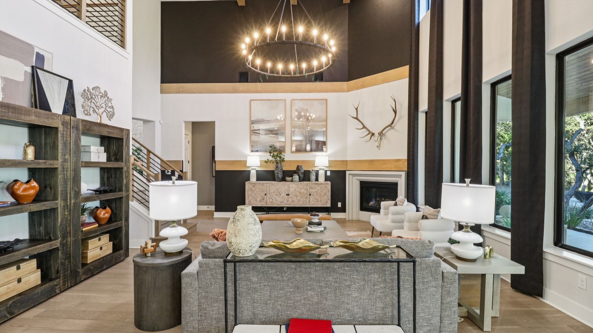Exquisite high ceilings, polished wood floors, and grand chandelier exemplify luxury living at Verandas at the Rim.