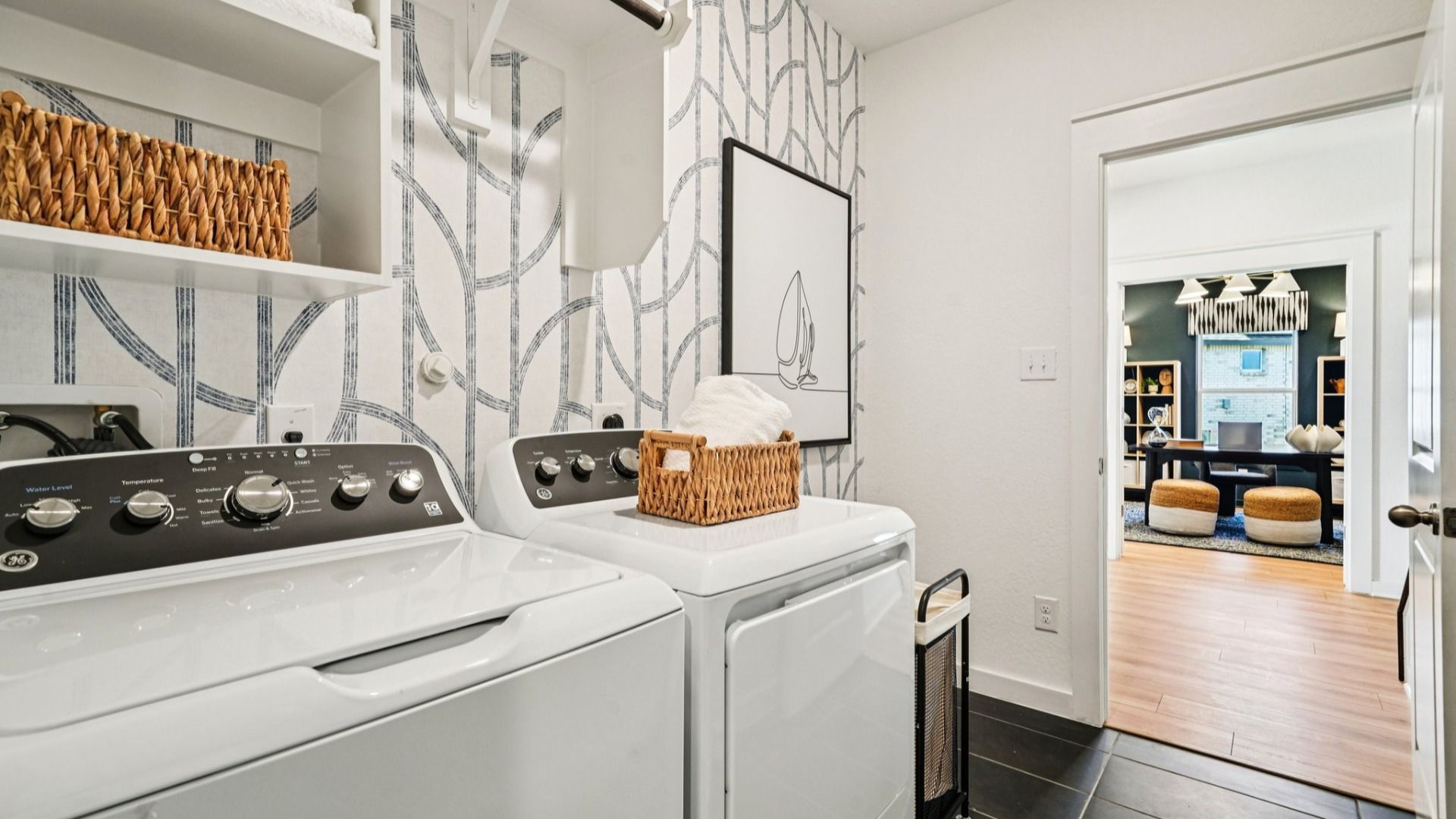 Laundry Room with Built-In Shelving, Closet Bar, and Ceramic Tile Flooring