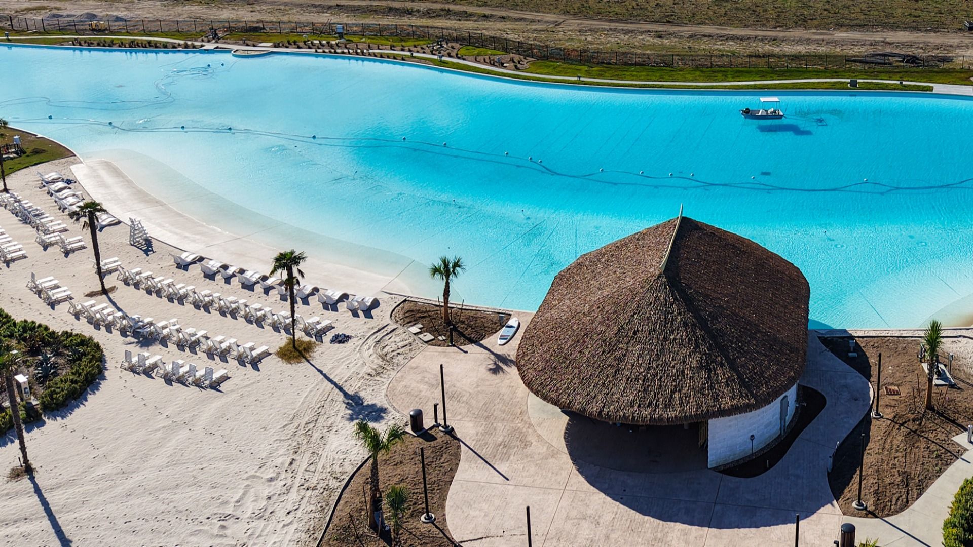 Experience opulent leisure by the pristine turquoise lagoon, complete with elegant loungers in River Ranch.
