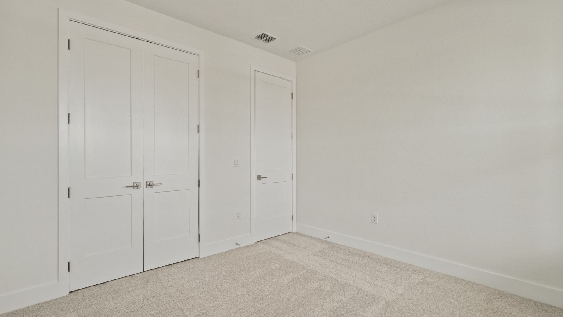 Spacious Bedroom with large closet in the Buttonwood floorplan by DRB Homes at Lakeside at Satilla in Saint Cloud, FL