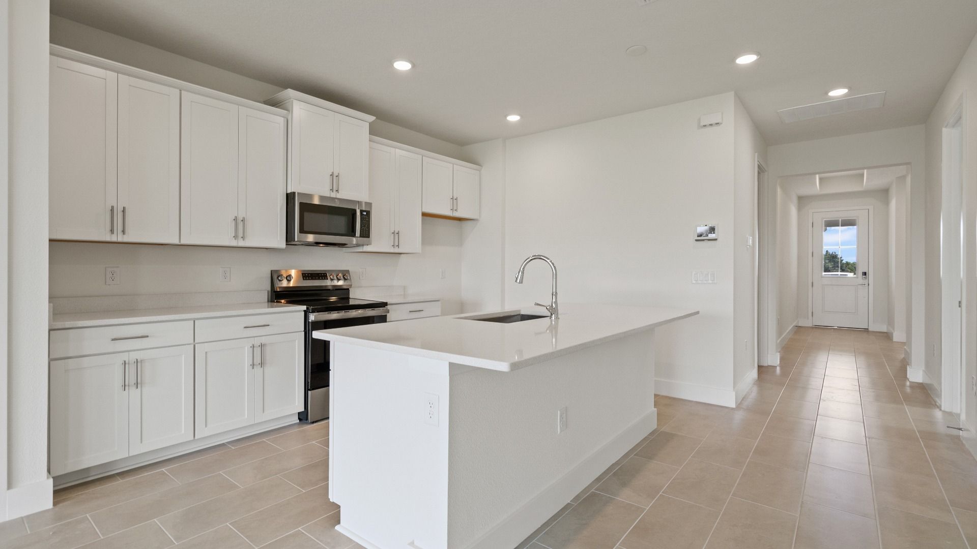 Kitchen in the Buttonwood floorplan by DRB Homes at Lakeside at Satilla in Saint Cloud, FL