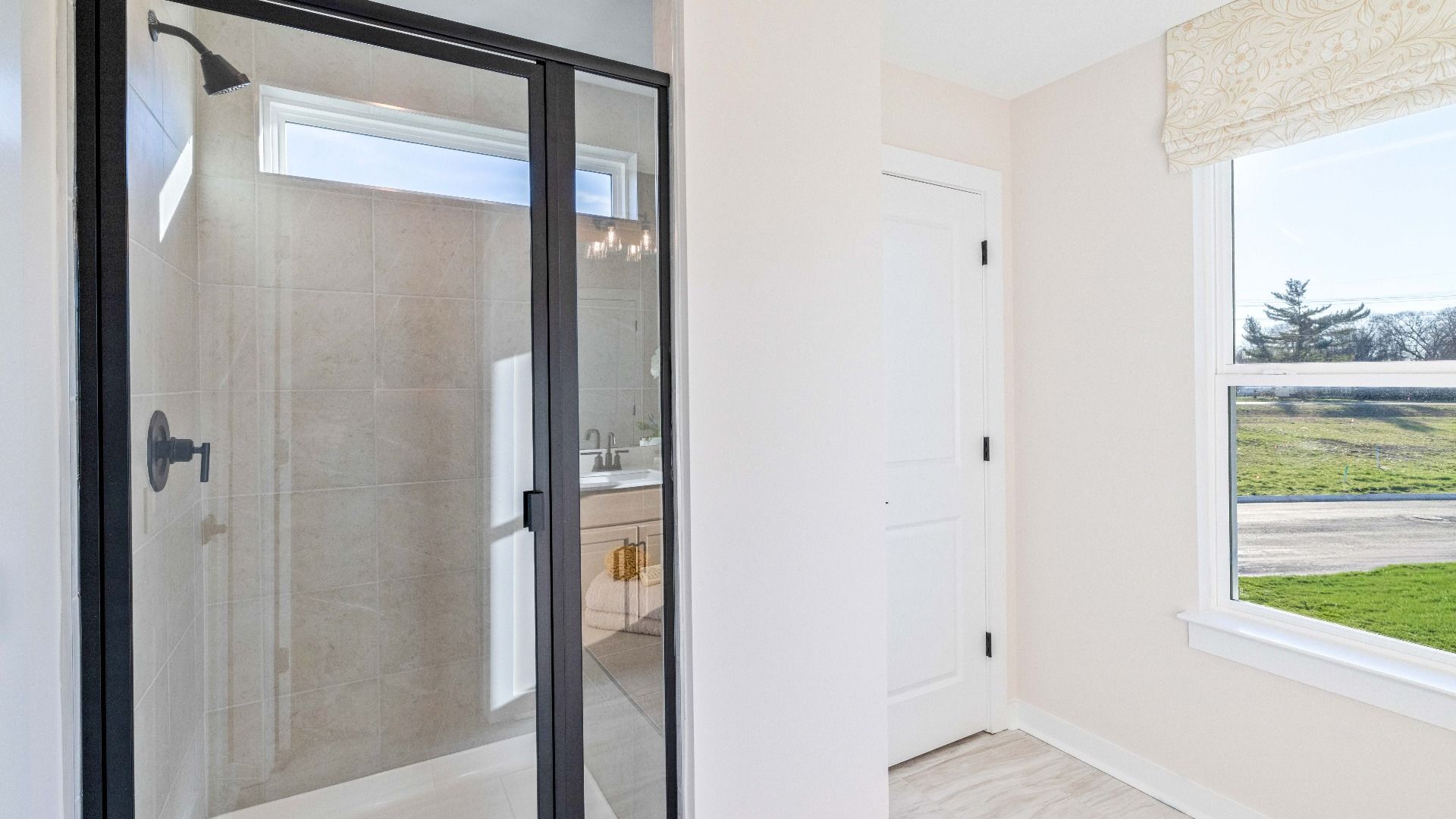 Walk-in tiled shower with linen closet